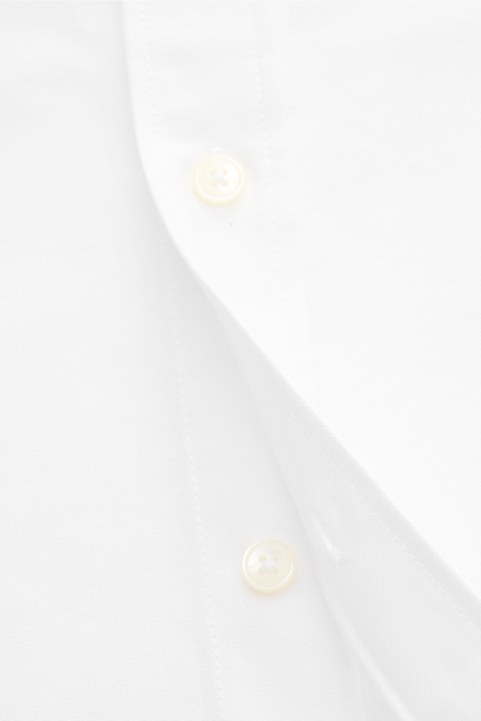 Close-up front view of Ami Paris Oxford shirt button-down collar white, showing pure cotton Oxford fabric, patch button placket with mother-of-pearl buttons, and signature heart stitching. For relaxed casual styles and more formal looks: This elegant shir