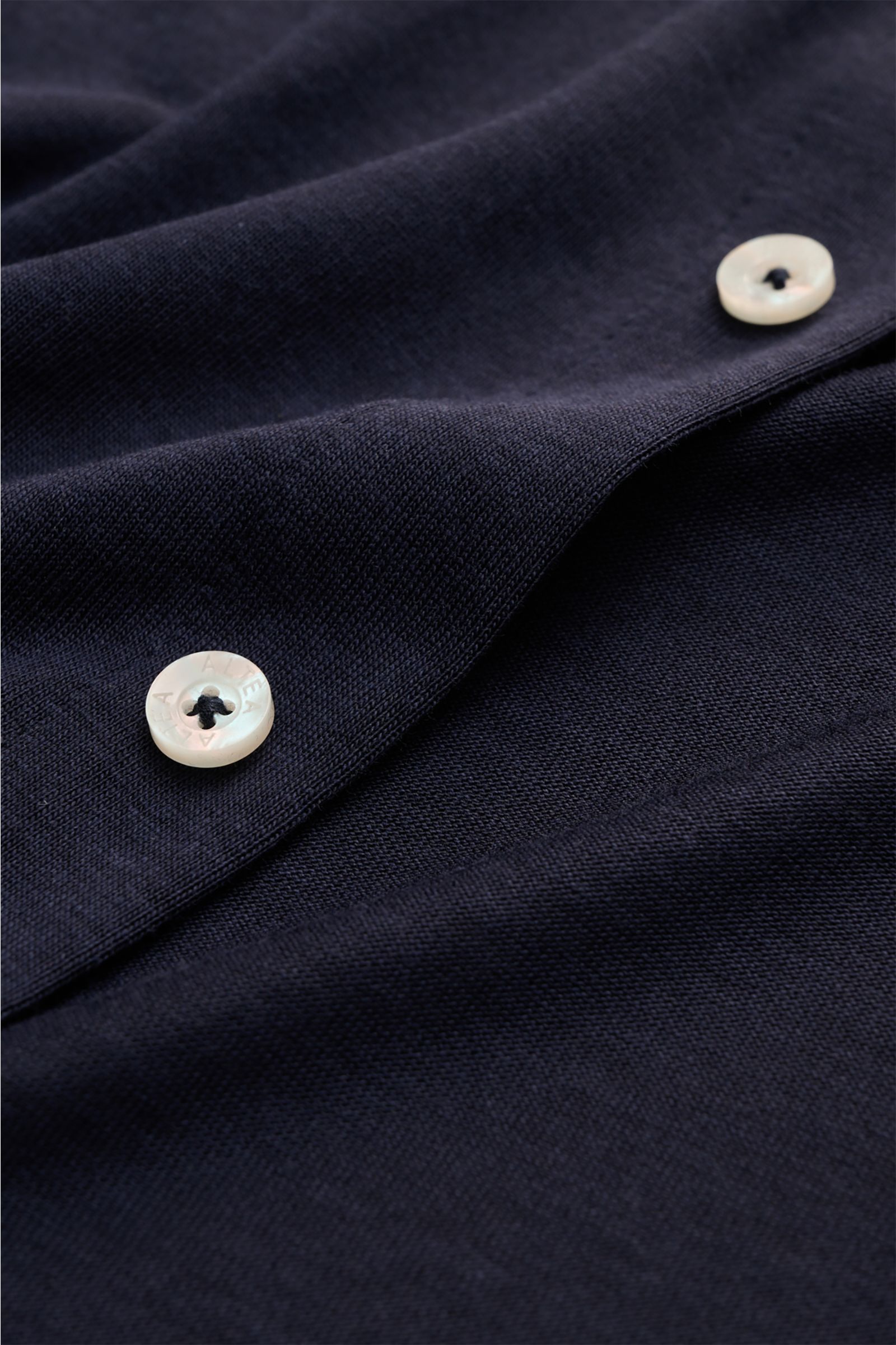 Close-up front view of Altea Jersey shirt 'Julius' polo shirt collar navy, showing the smooth button placket, fine fabric, and white buttons.