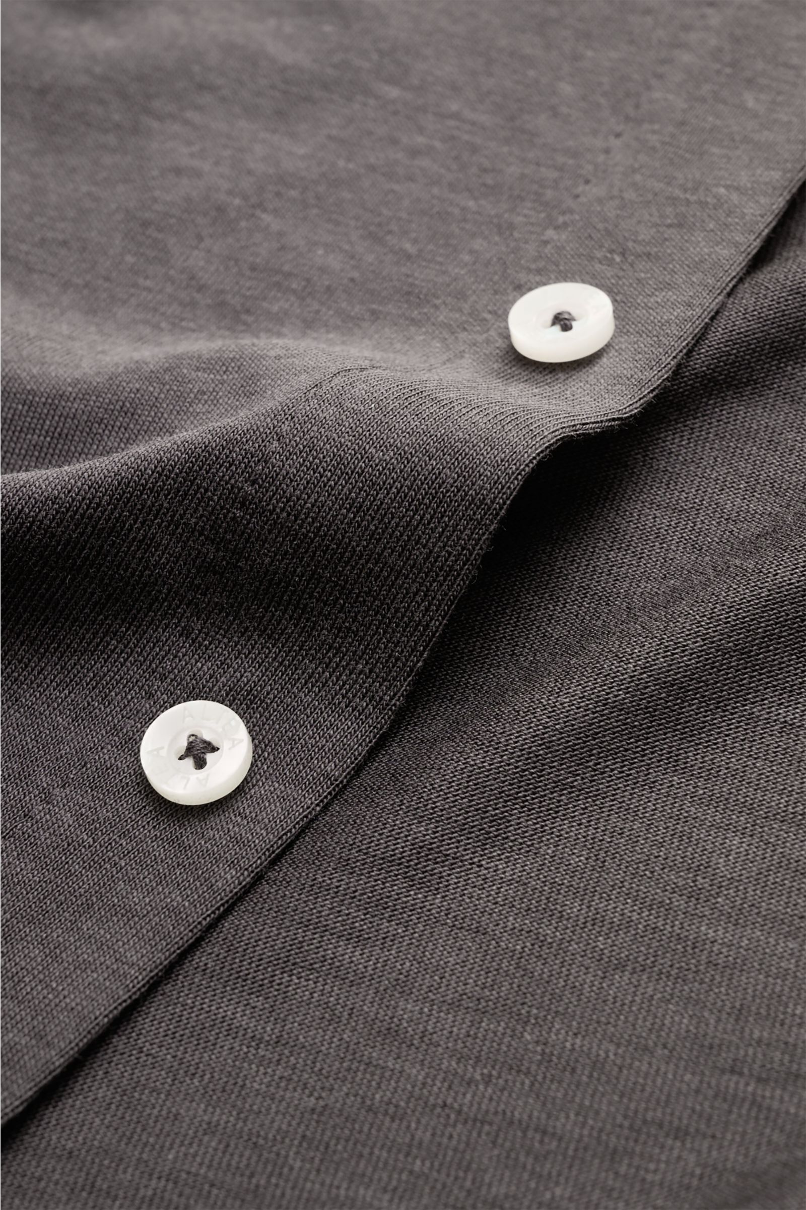 Close-up front view of dark brown Altea Jersey shirt 'Julius' polo shirt collar showing soft fine fabric, smooth button placket, and white buttons.
