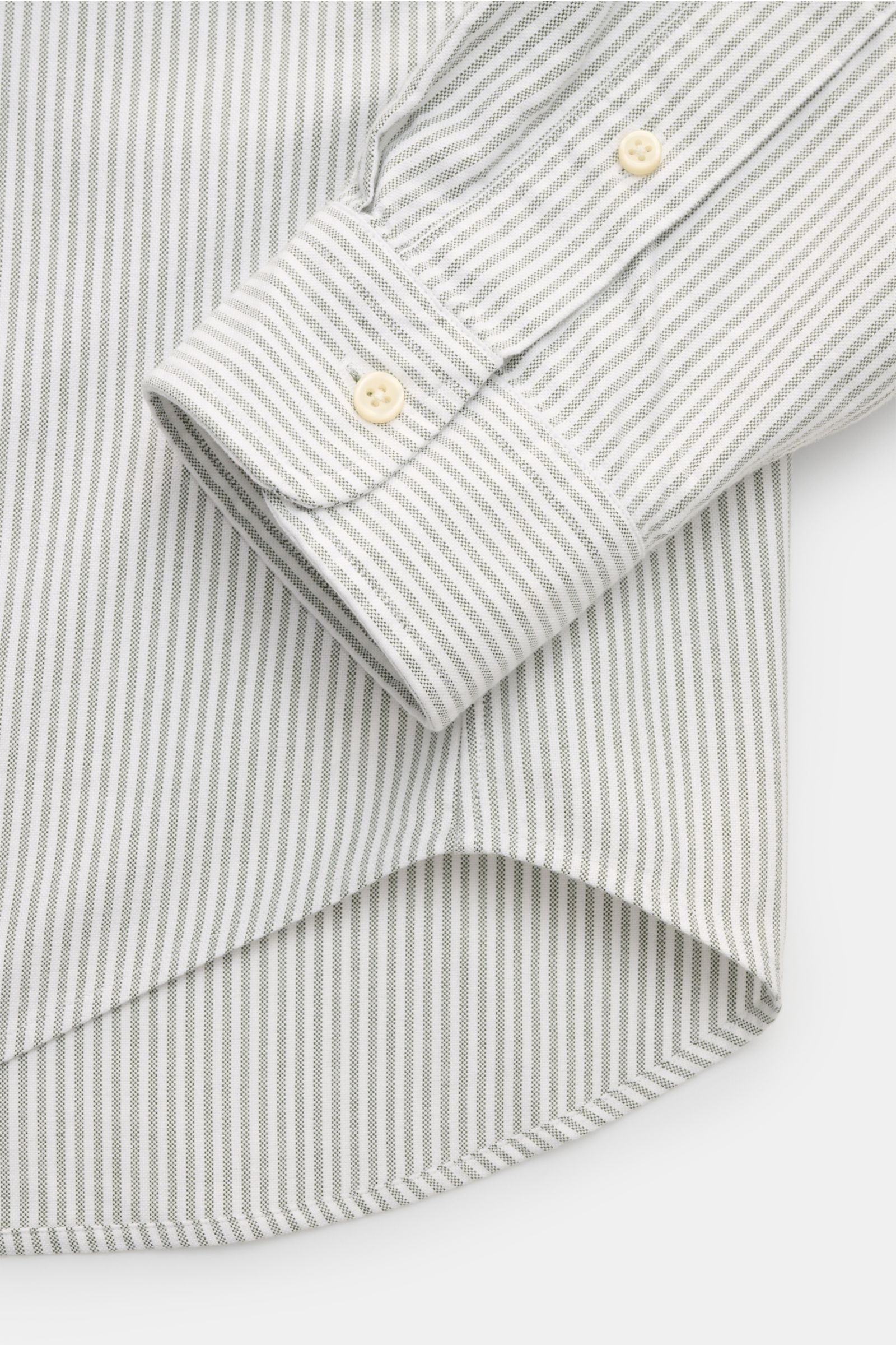 Close-up top view of Polo Ralph Lauren Oxford shirt button-down collar dark green/white striped, showing cuff, button placket, and rounded hem. A stylish classic with attention to detail: This sporty shirt by POLO RALPH LAUREN made of pure cotton with but