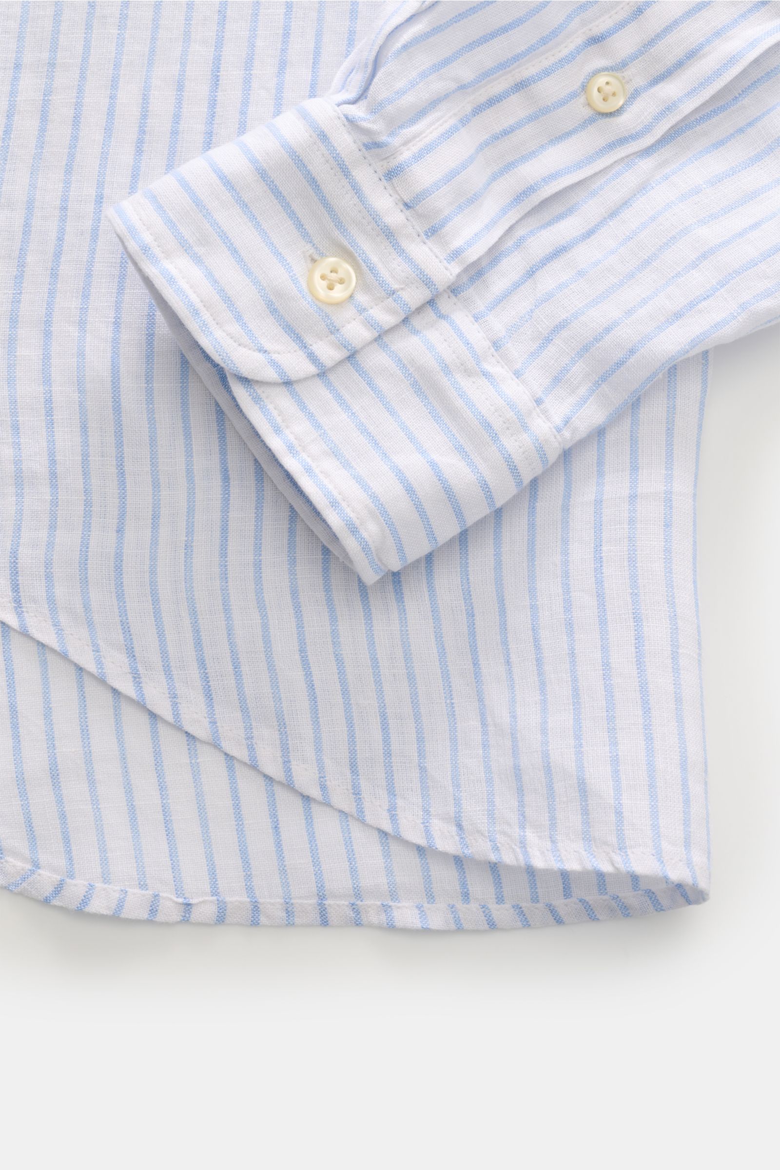Polo Ralph Lauren Linen shirt button-down collar white/light blue striped shown close-up from above, highlighting cuff and fabric texture. A summer classic from POLO RALPH LAUREN: This minimalist slim fit shirt in the finest linen with button-down coll