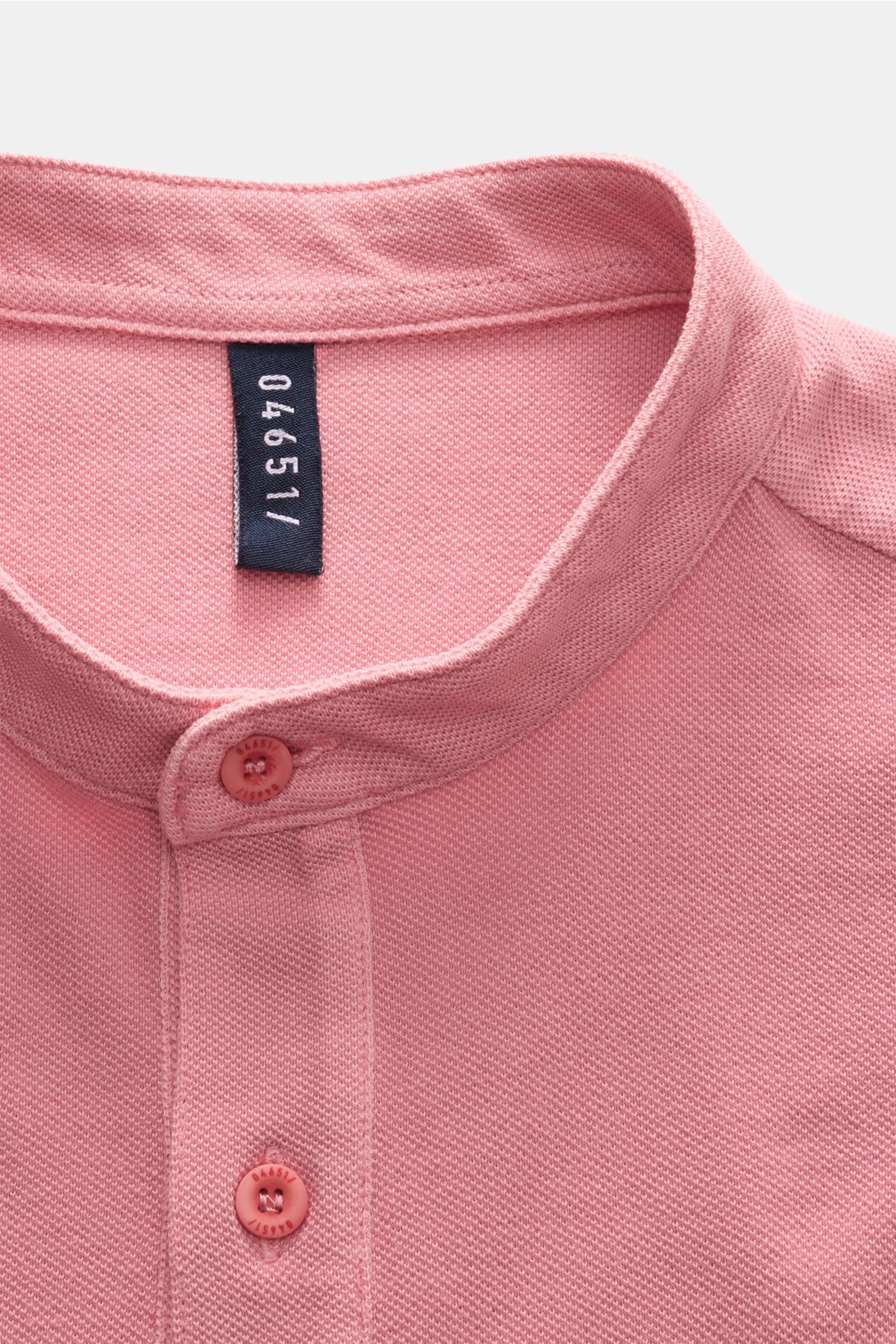 Close-up of pink 04651/ A trip in a bag Hemd Sport shirt, showing textured fabric, buttons, and collar from above.