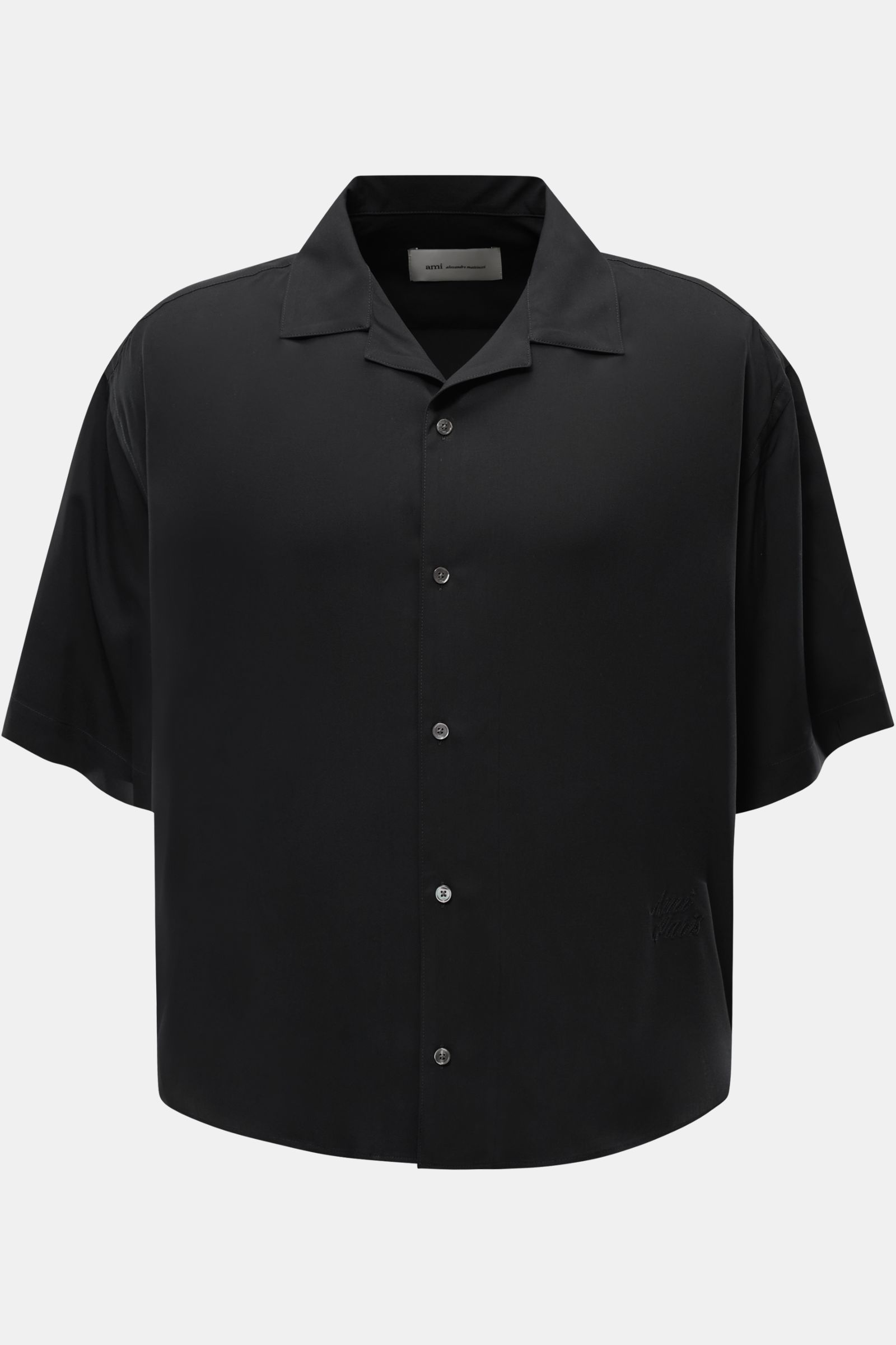 A front view of Ami Paris Short sleeve shirt 'Boxy' Cuban collar black, a modern, casual short sleeve shirt with pure viscose, soft feel, oversized fit, French button placket, logo stitching, and rounded hem. Modern and casual: With its 'Boxy' fit, this s