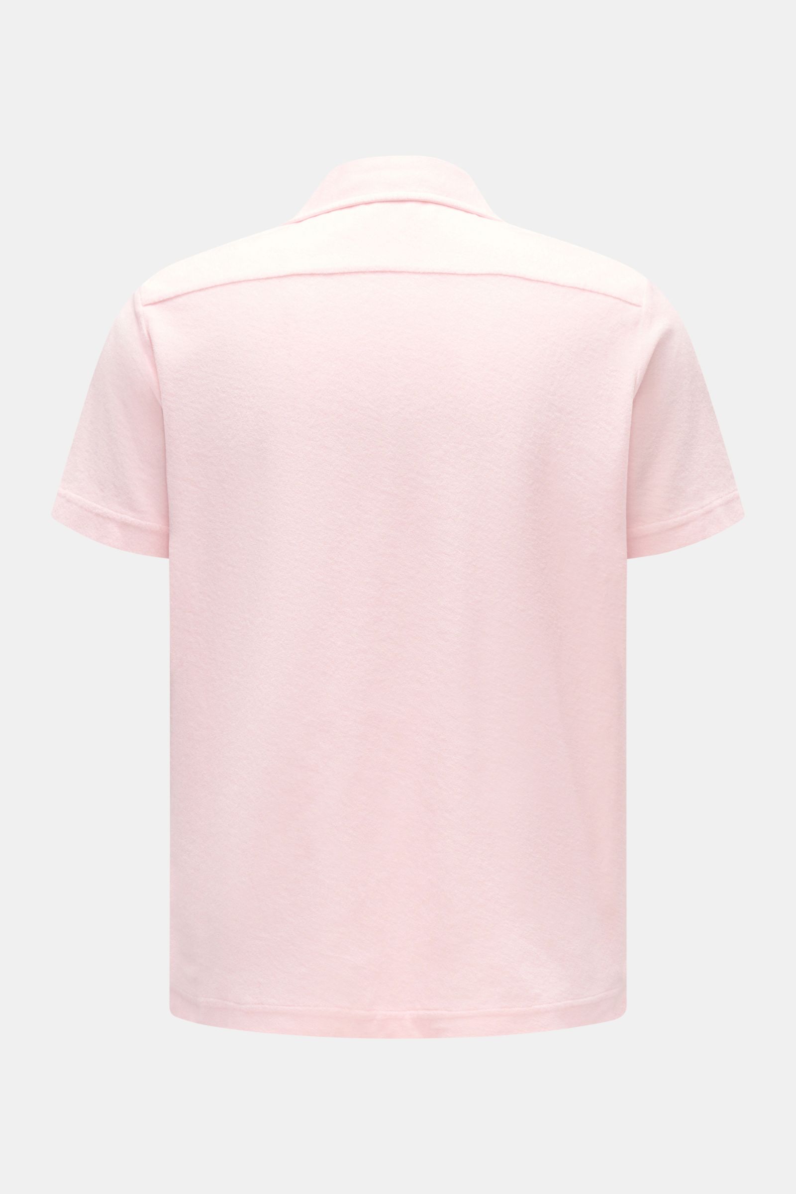 Rear view of 04651/ A trip in a bag Frottee-Kurzarmhemd 'Terry Cuba' rosé, a soft, regular fit, short-sleeve shirt with Cuban collar, cotton terry fabric, French button placket, small side seam label, and short hem slits, photographed against a plain ligh