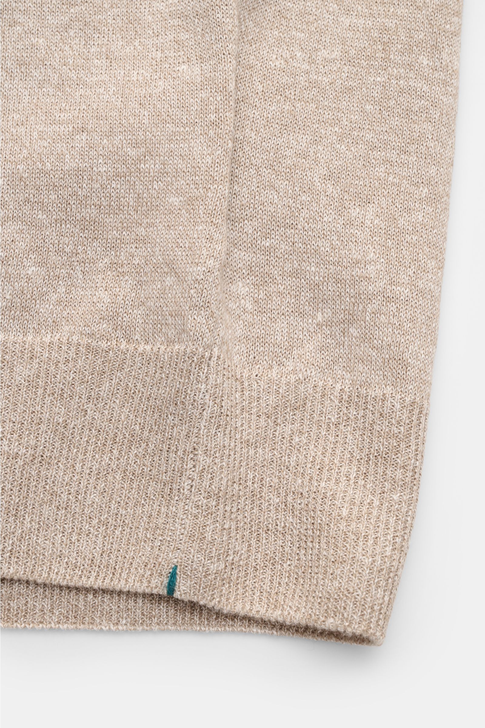 Close-up front view of Fioroni Short sleeve knit polo beige mottled showing fine, airy linen and cotton blend knit fabric with ribbed bands.

Summery luxury: This short-sleeved knit polo by FIORONI embodies the finest Italian knitwear artisanship and i