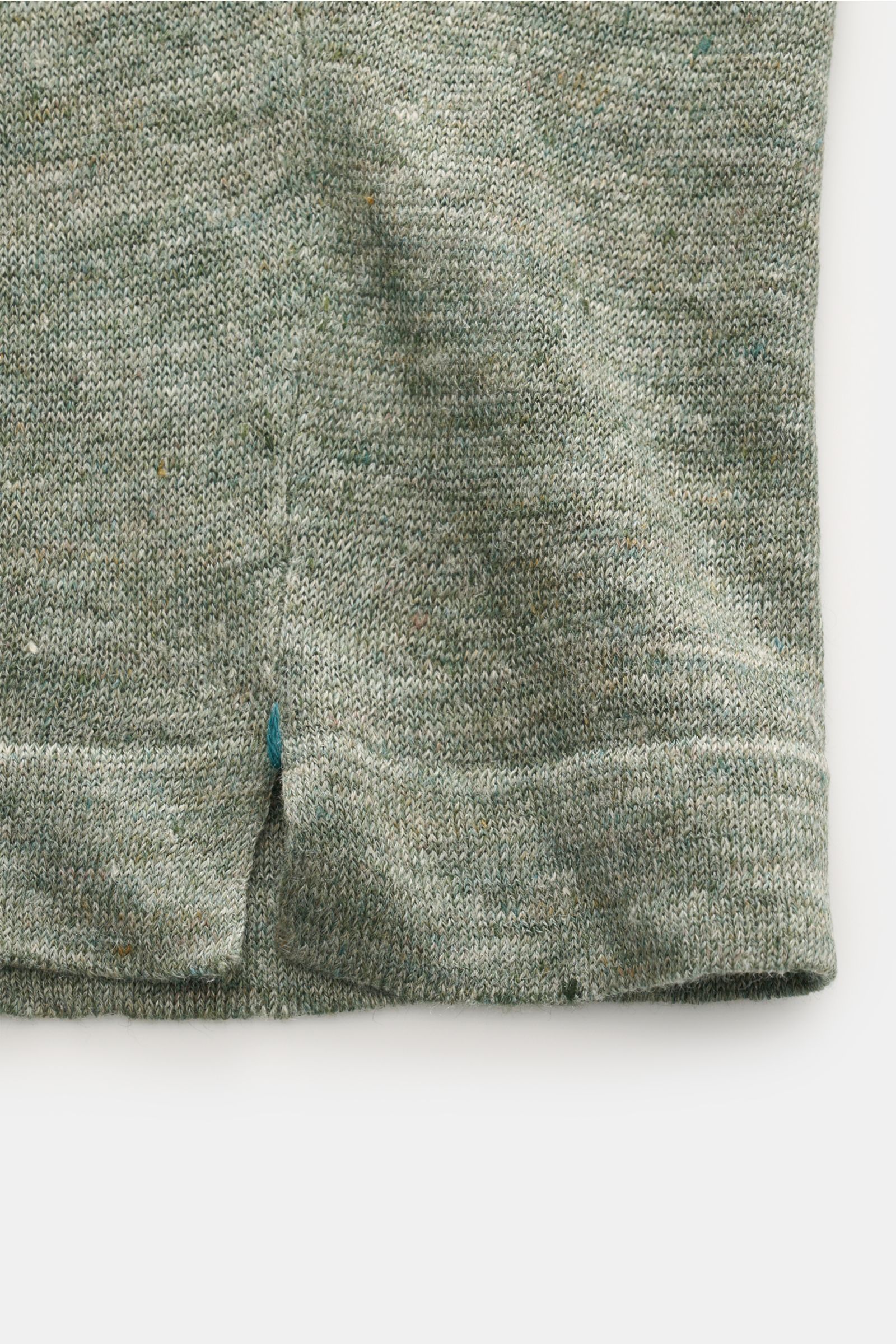 Close-up front lower hem view of Fioroni Linen short sleeve knit polo dark green/beige mottled, showing fine, airy knit and narrow bands.

Summery lightness by FIORINI: This short sleeve knit polo embodies the best Italian quality and is made of pure l