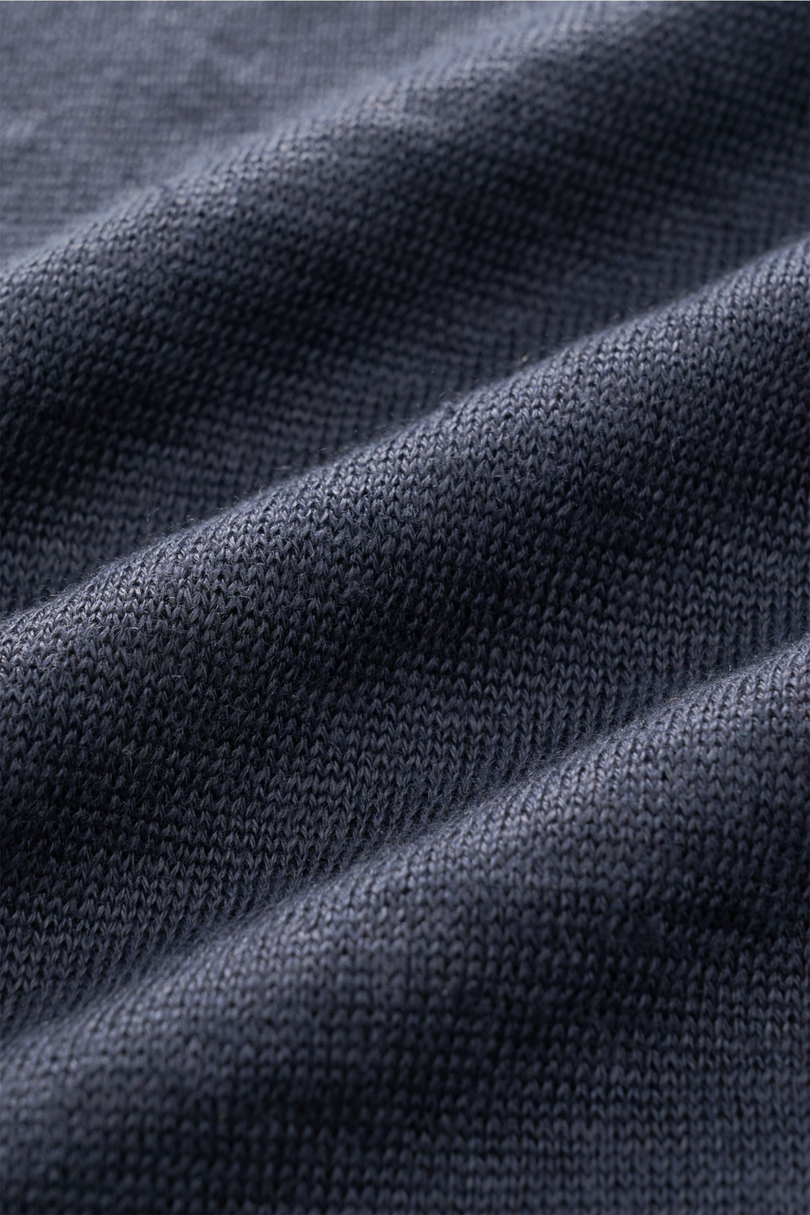 Close-up front view of Fioroni Linen short sleeve knit polo navy mottled fabric showing fine, airy knit texture and summery lightness.

Summery lightness by FIORINI: This short sleeve knit polo embodies the best Italian quality and is made of pure line