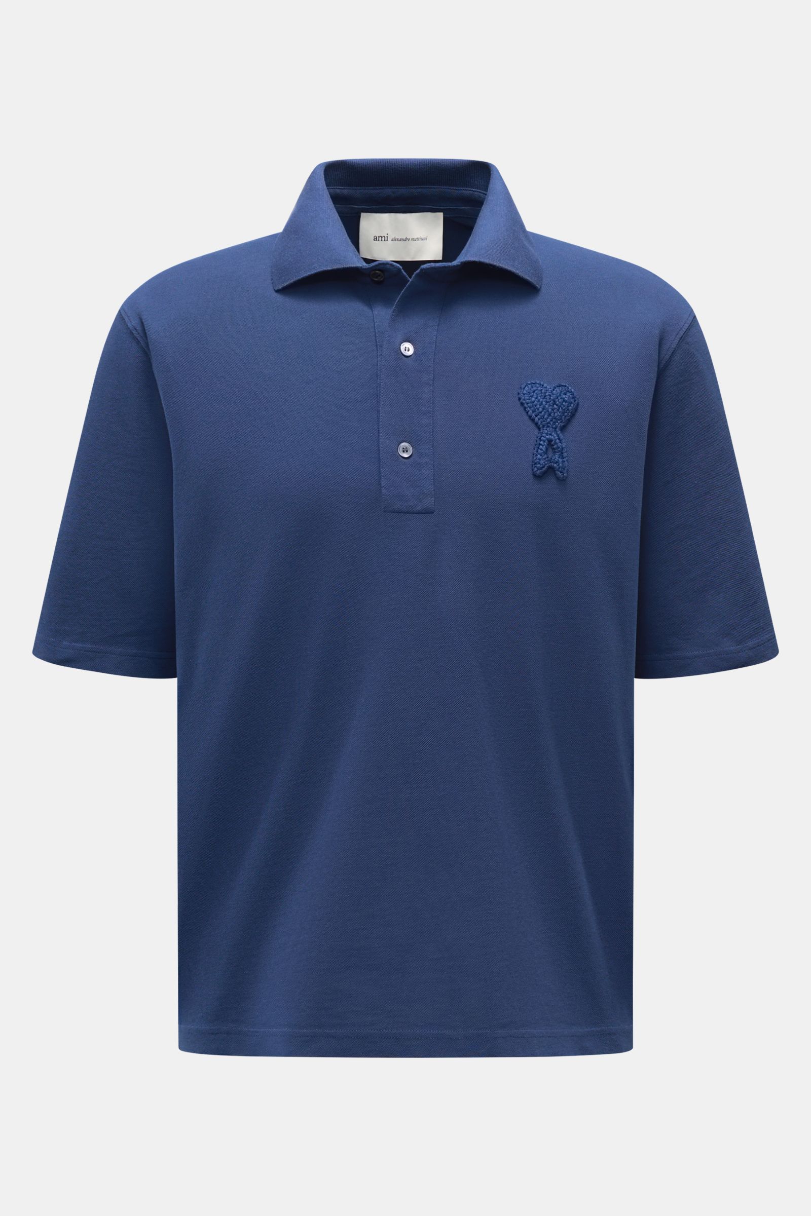 Front view of Ami Paris Poloshirt 'Boxy Fit' dunkelblau, a classic polo with a straight cut for casual spring looks, made from pure cotton with fine piqué texture, soft feel, oversized fit, typical polo collar, three-button placket, and label-typical logo