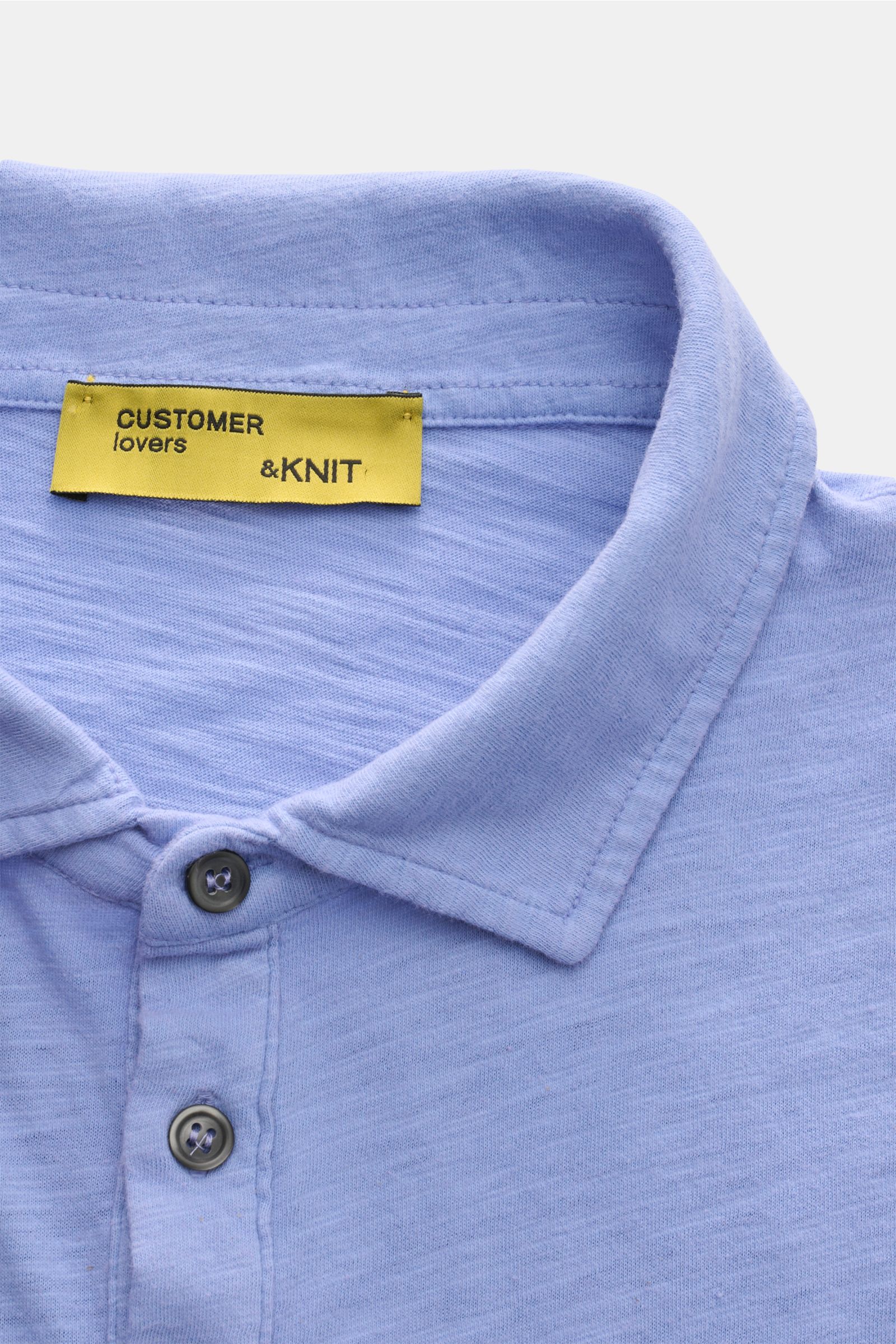 Close-up front view of B.F. Knitwear Jersey polo shirt blue mottled showing soft pure cotton fabric, slim fit, classic polo shirt collar, and two buttons. Uncomplicated classic: This jersey polo shirt by B.F. KNITWEAR is a versatile basic for the warmer m