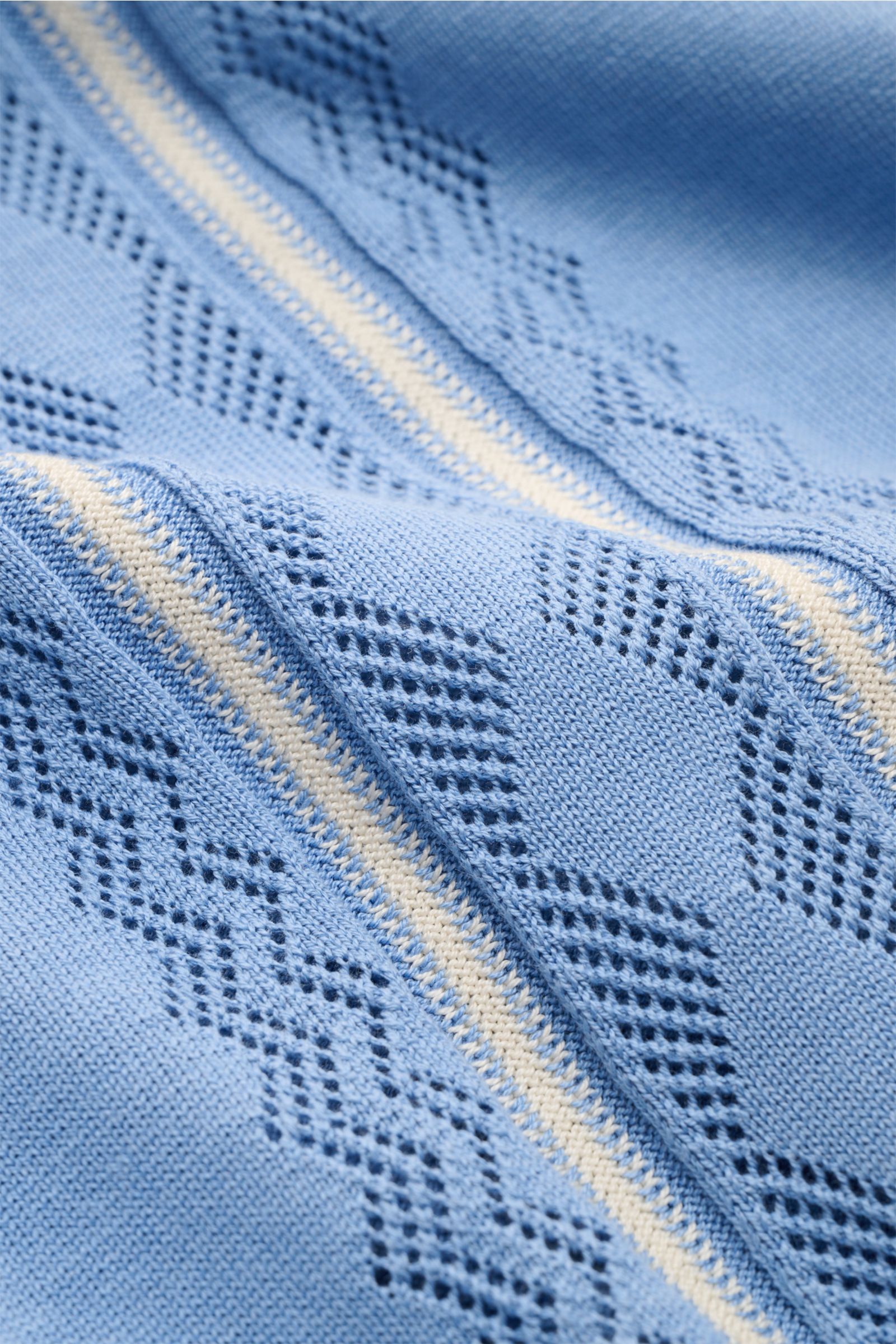 Close-up front view of the Piacenza 1733 Short sleeve knit polo smoky blue, showing fine silk-cotton blend, perforated knit, and contrasting stripes.

Get a tasteful look for the summer season: This short sleeve knit polo by PIACENZA 1733 is made of a lux