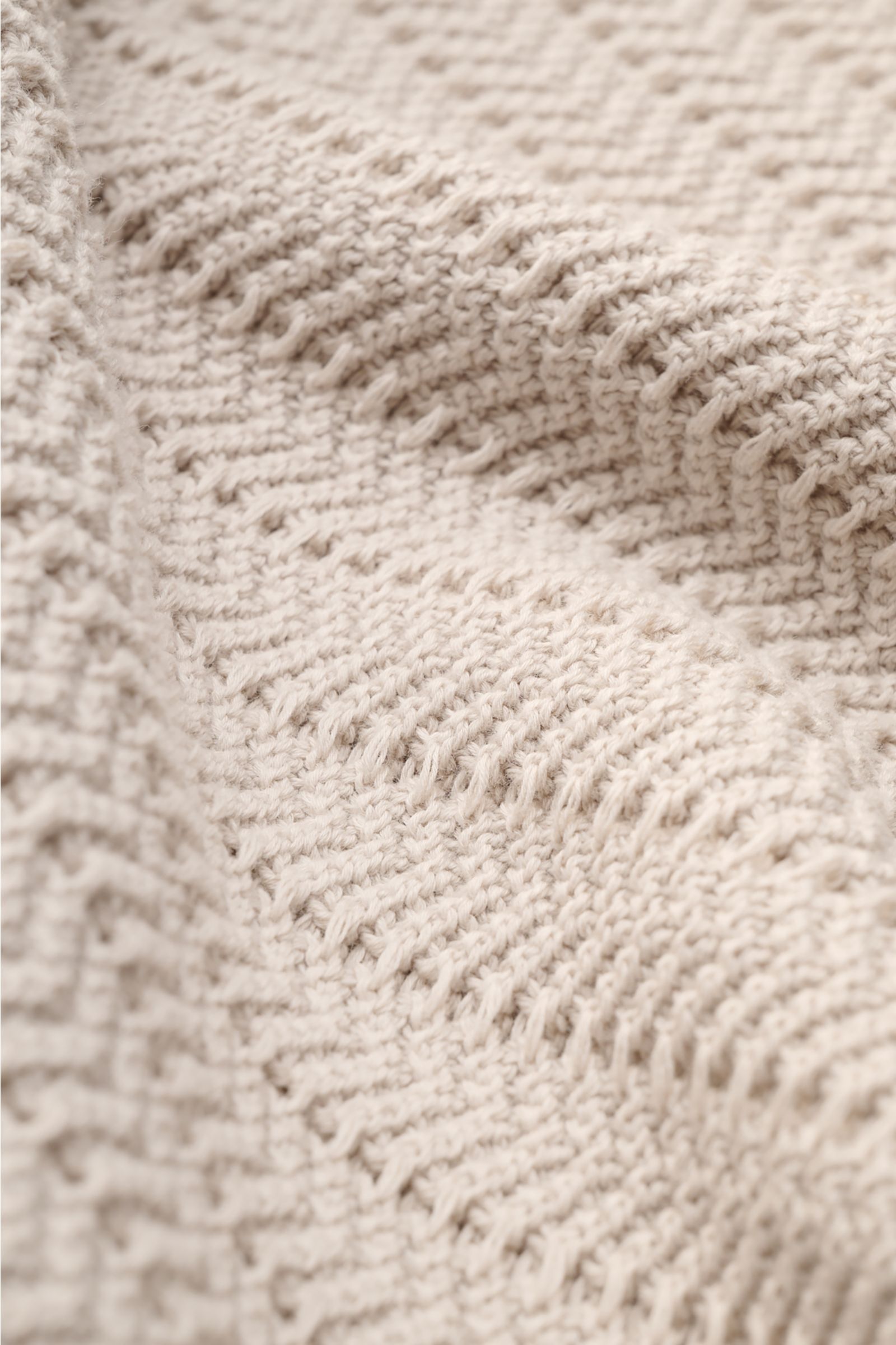 Close-up front view of Gran Sasso Short sleeve knit polo beige, showing robust, striking knit fabric texture and wide ribbed bands in pure cotton. Classic polo silhouette with open collar placket and slim fit, photographed to highlight fabric thickness an