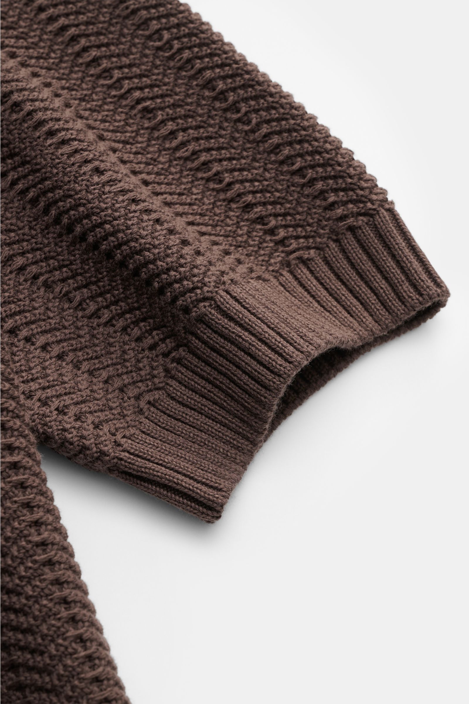 Gran Sasso Short sleeve knit polo dark brown sleeve detail showing heavy knit texture and wide ribbed bands, photographed close-up from the side. Classic polo silhouette meets a distinctive fabric thickness: This short sleeve knit polo in pure cotton by B