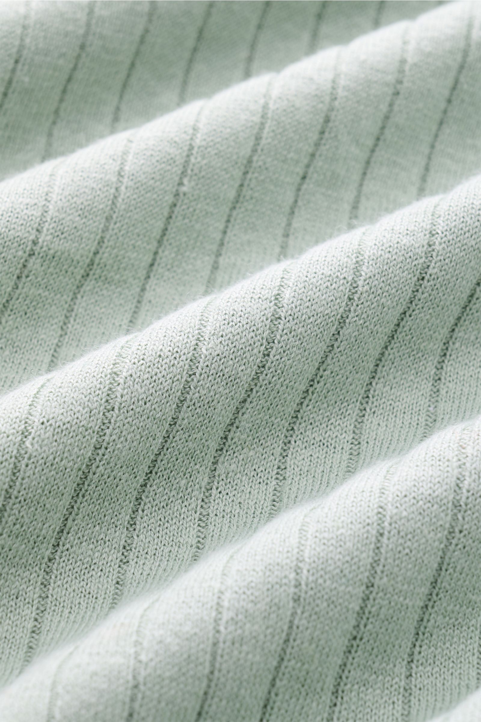 Close-up front view of the MC2 Saint Barth Short sleeve knit polo mint green showing fine knit linen-cotton fabric with ribbed texture and soft feel.