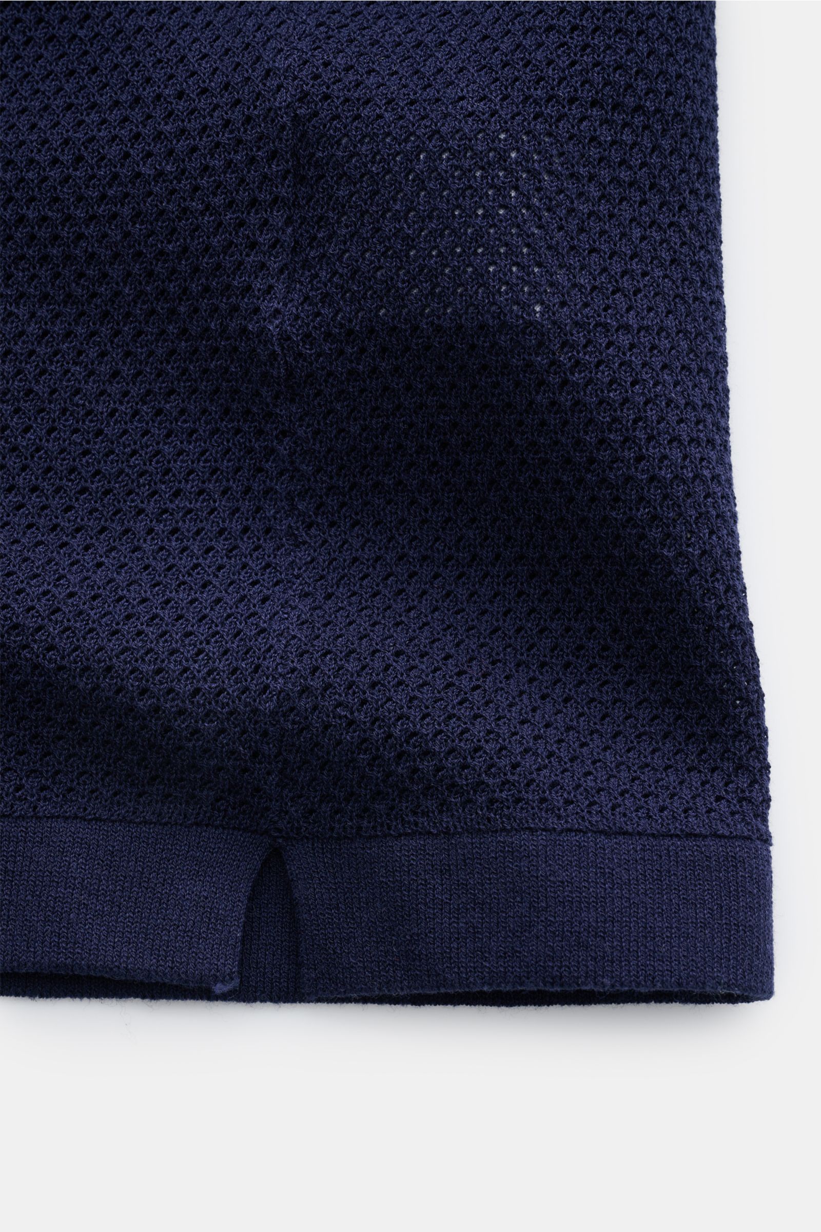 Close-up front view of the hem and texture of the MC2 Saint Barth Short sleeve knit polo 'Sloan' navy showing fine, airy pure cotton knit with a slightly granular texture.

Light and summery: This knit polo shirt by 