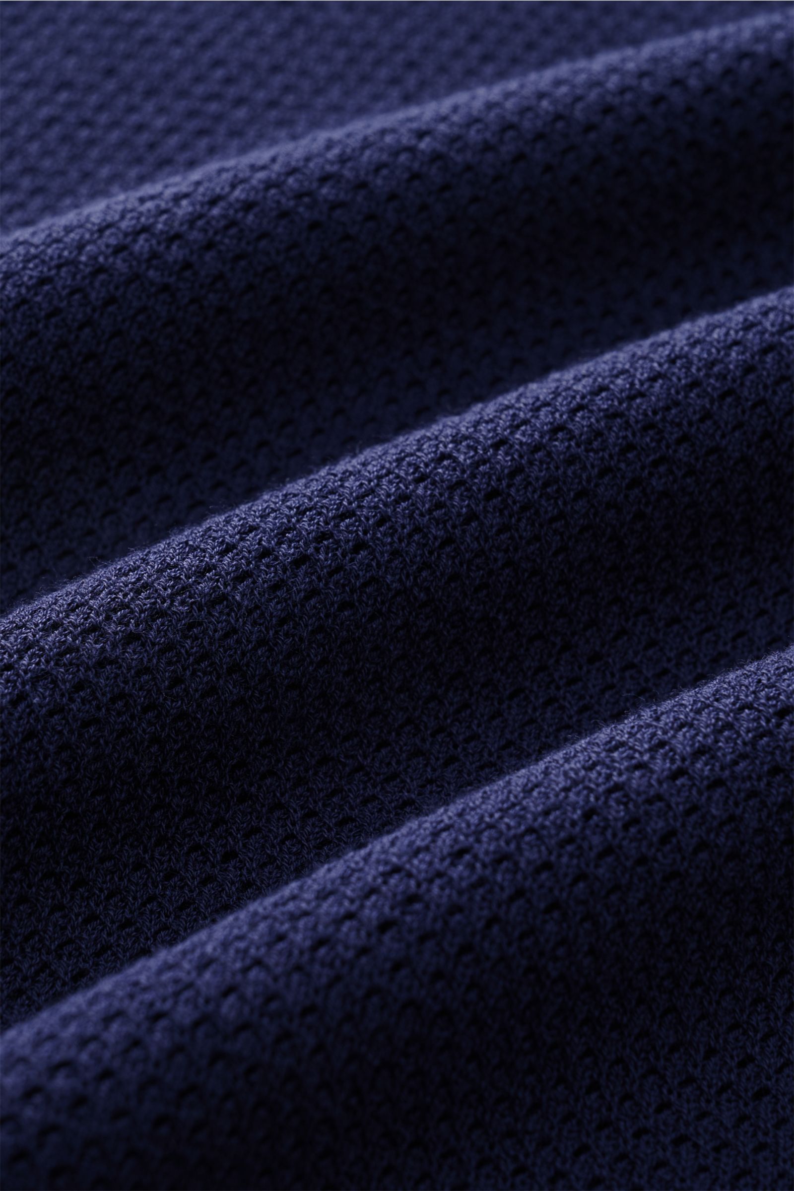 Close-up front view of the navy fabric texture of the MC2 Saint Barth Short sleeve knit polo 'Sloan' navy, showing fine, slightly granular cotton knit.

Description: Light and summery: This knit polo shirt by 