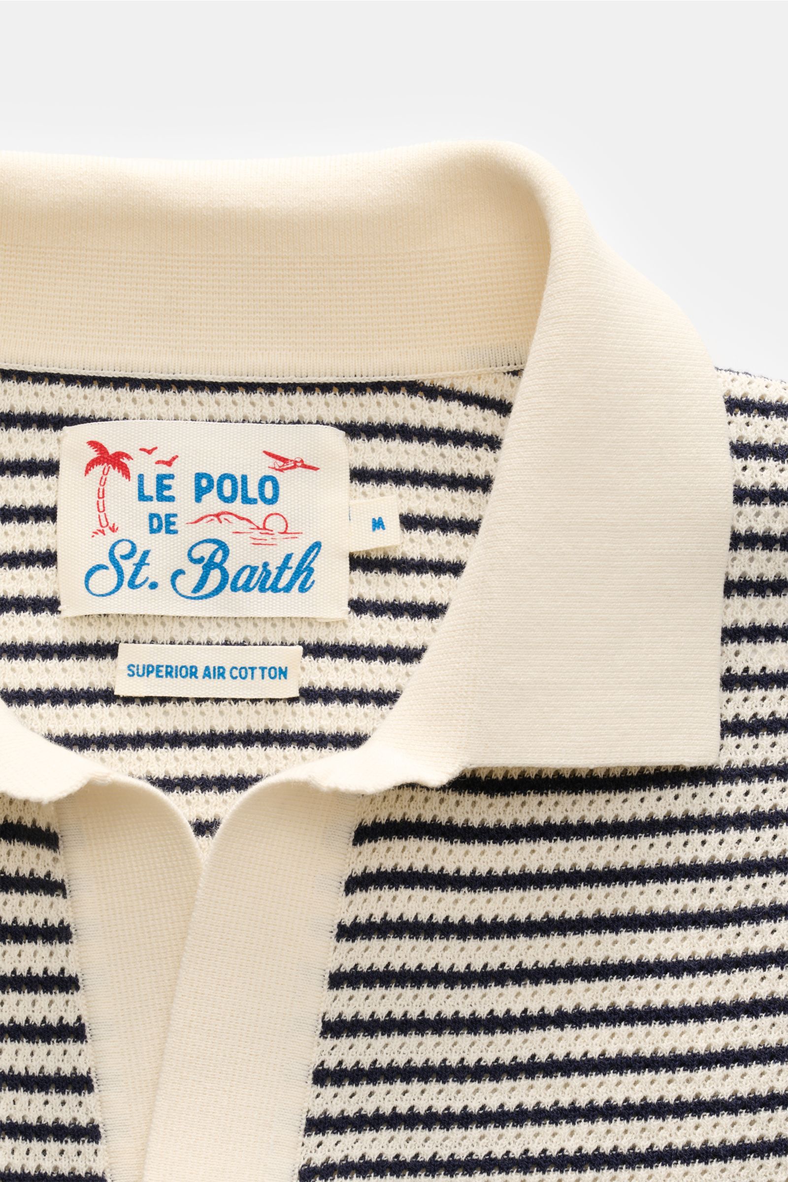 Close-up front view of the MC2 Saint Barth Short sleeve knit polo 'Sloan' cream/navy striped collar and label, showing fine textured knit.

Light and summery: This knit polo shirt by 