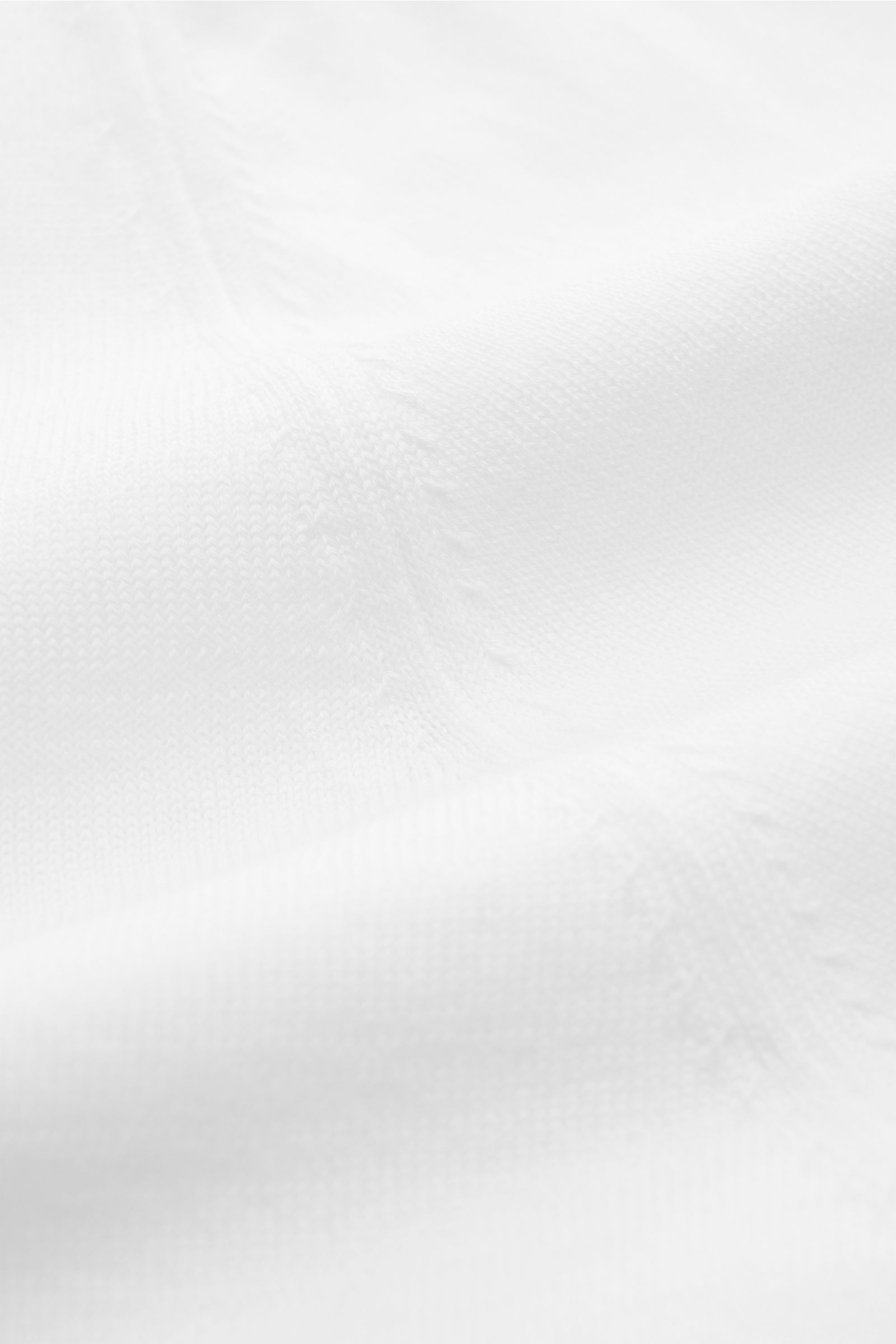 Close-up front angle of Filippo de Laurentiis Short sleeve knit polo shirt white, showcasing fine cotton knit texture and ribbed bands.

Summery elegance at its most relaxed: This short sleeve knit polo by FILIPPO DE LAURENTIIS is made of a fine cotton