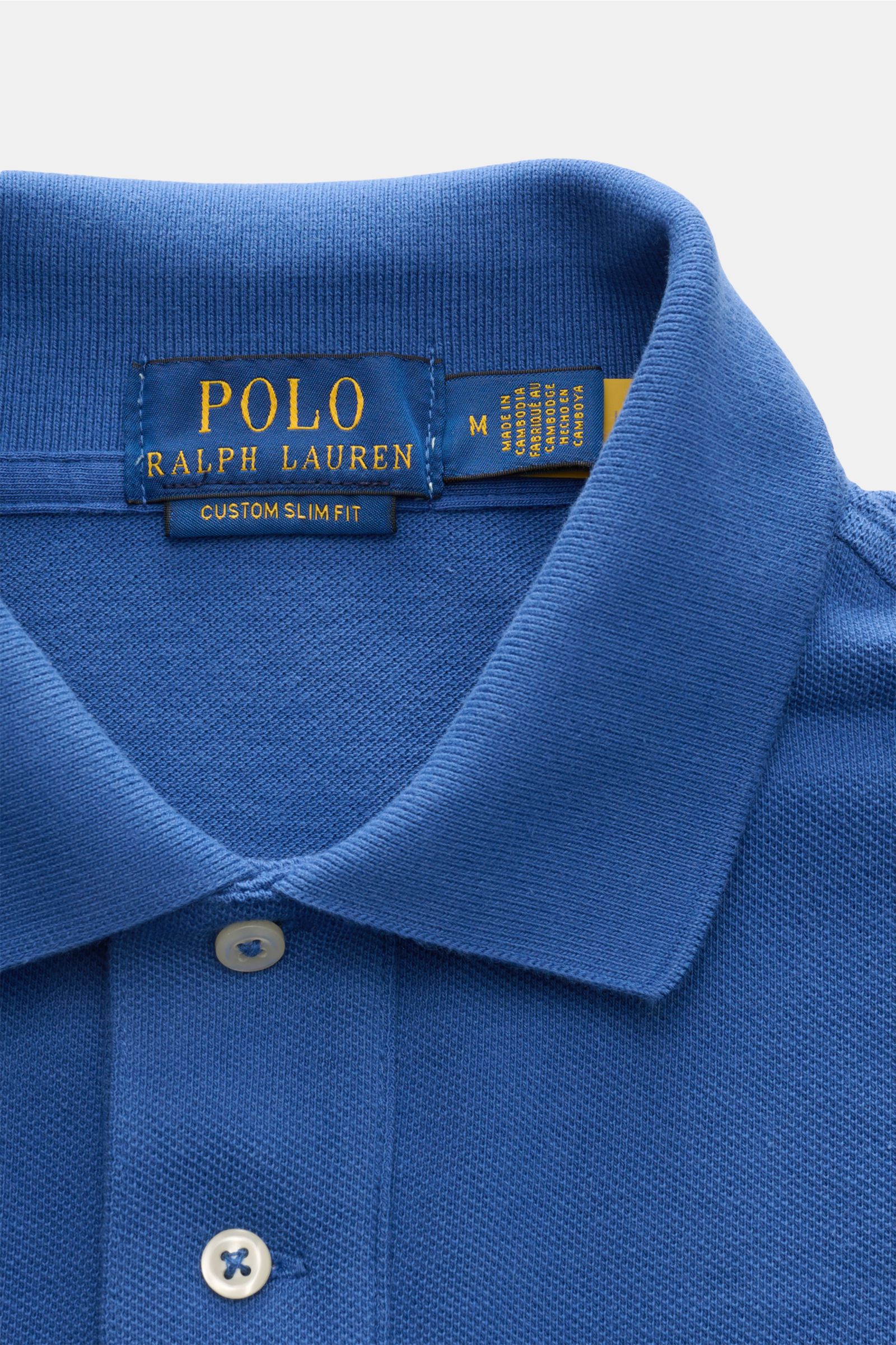 Close-up front view of Polo Ralph Lauren Polo shirt dark blue featuring a classic collar, two-button placket, and fine piqué cotton fabric. The classic among polo shirts since 1972: The iconic pure cotton piqué model with the famous polo rider stitching o