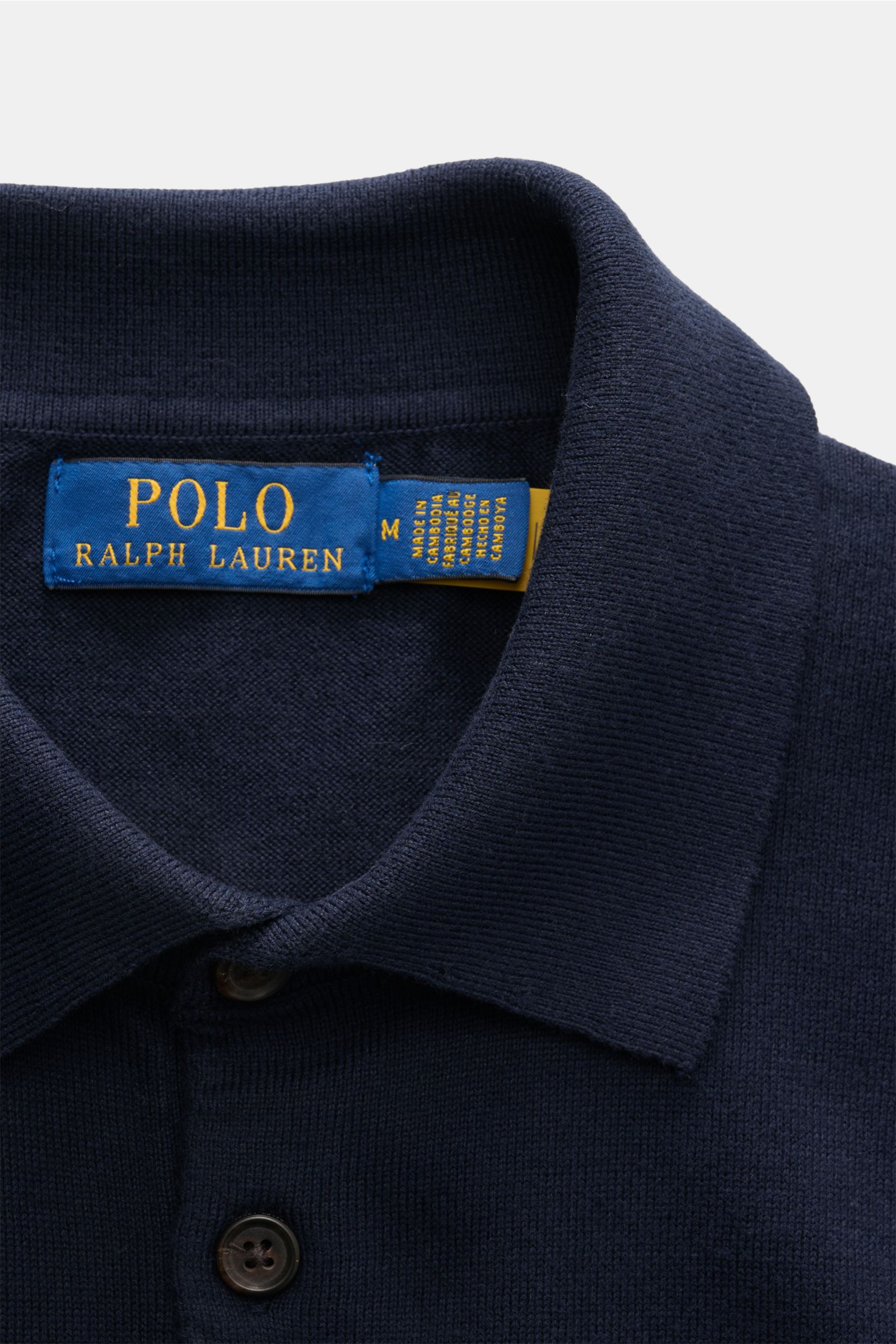 Nahaufnahme des Polo Ralph Lauren Kurzarm-Strickpolo navy, fotografiert von oben, mit Polokragen und Label-Stitching.
