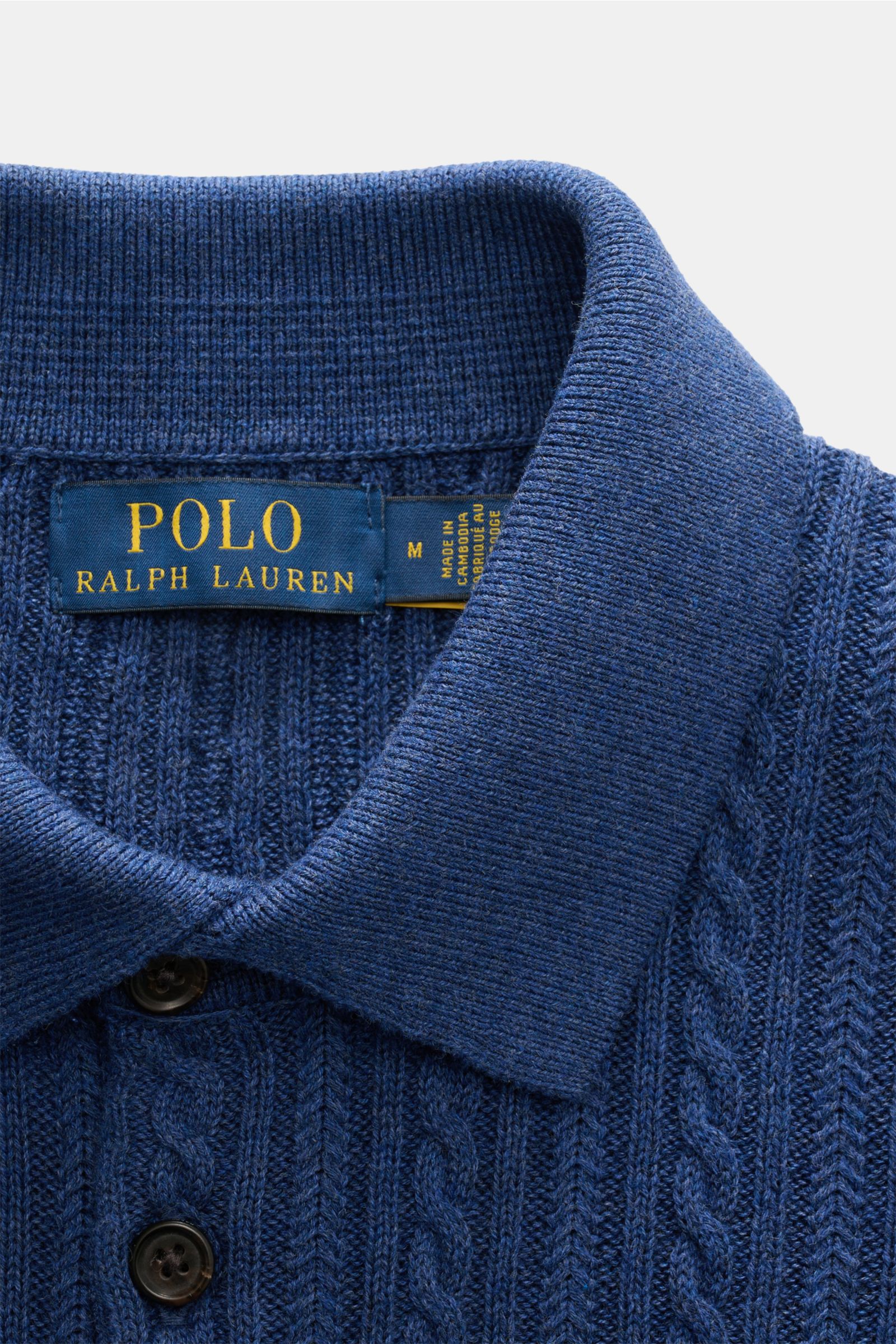Close-up front view of Polo Ralph Lauren Short sleeve knit polo shirt navy showing collar, buttons, and cable knit pattern in fine cotton.

Versatile classic: This short-sleeved knit polo by POLO RALPH LAUREN delivers maximum comfort and catches the ey