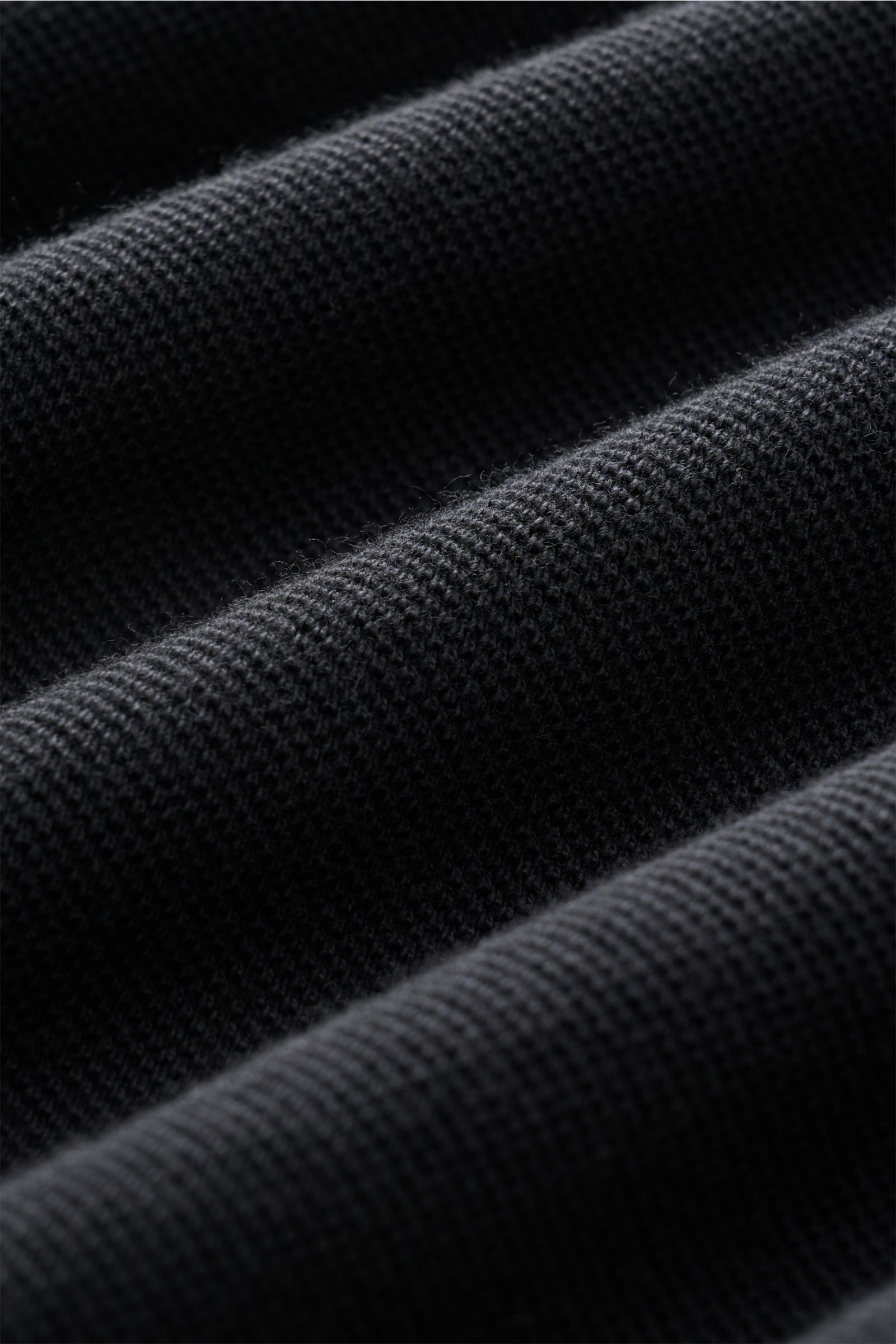 Close-up, detailed front-angle view of the textured anthracite fabric of the 04651/ A trip in a bag Polo shirt 'Johnny'.

For relaxed casual looks: 04651/ A TRIP IN A BAG brings a relaxed summer vibe to your wardrobe with this pure cotton polo shirt fe
