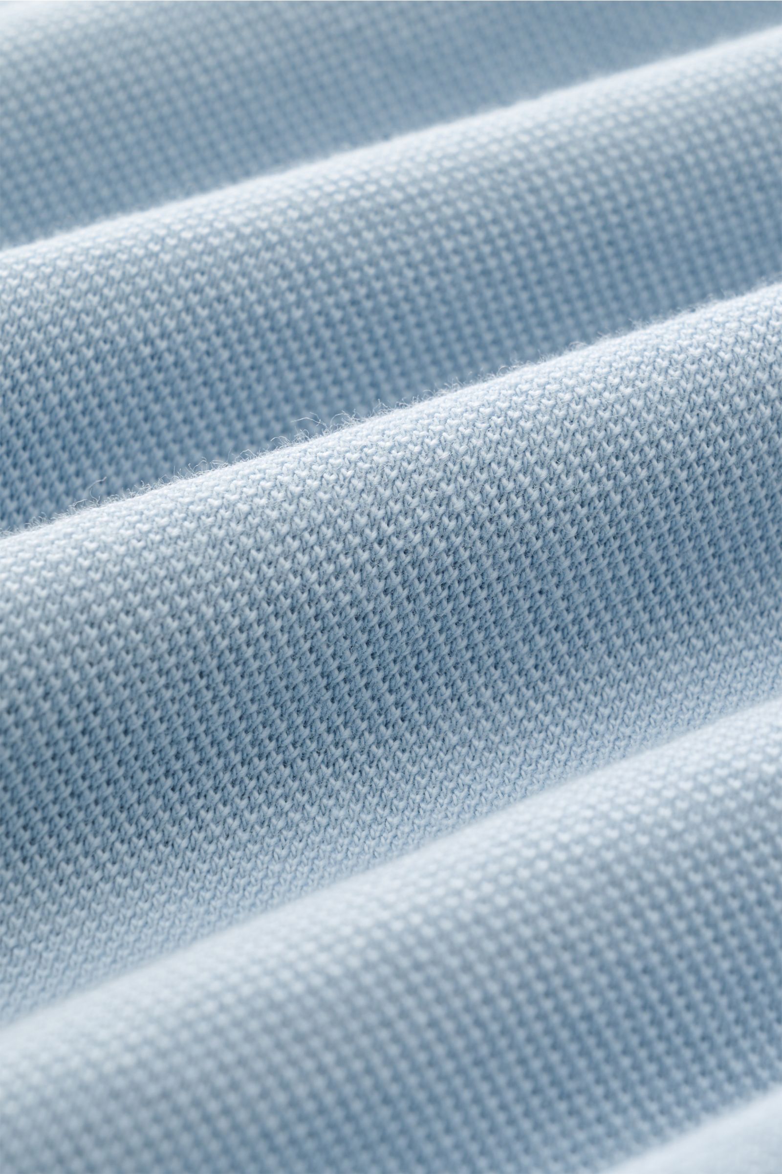Close-up fabric texture of the 04651/ A trip in a bag Polo shirt 'Johnny' smoky blue, showing soft piqué cotton knit.

Description: For relaxed casual looks: 04651/ A TRIP IN A BAG brings a relaxed summer vibe to your wardrobe with this pure cotton pol