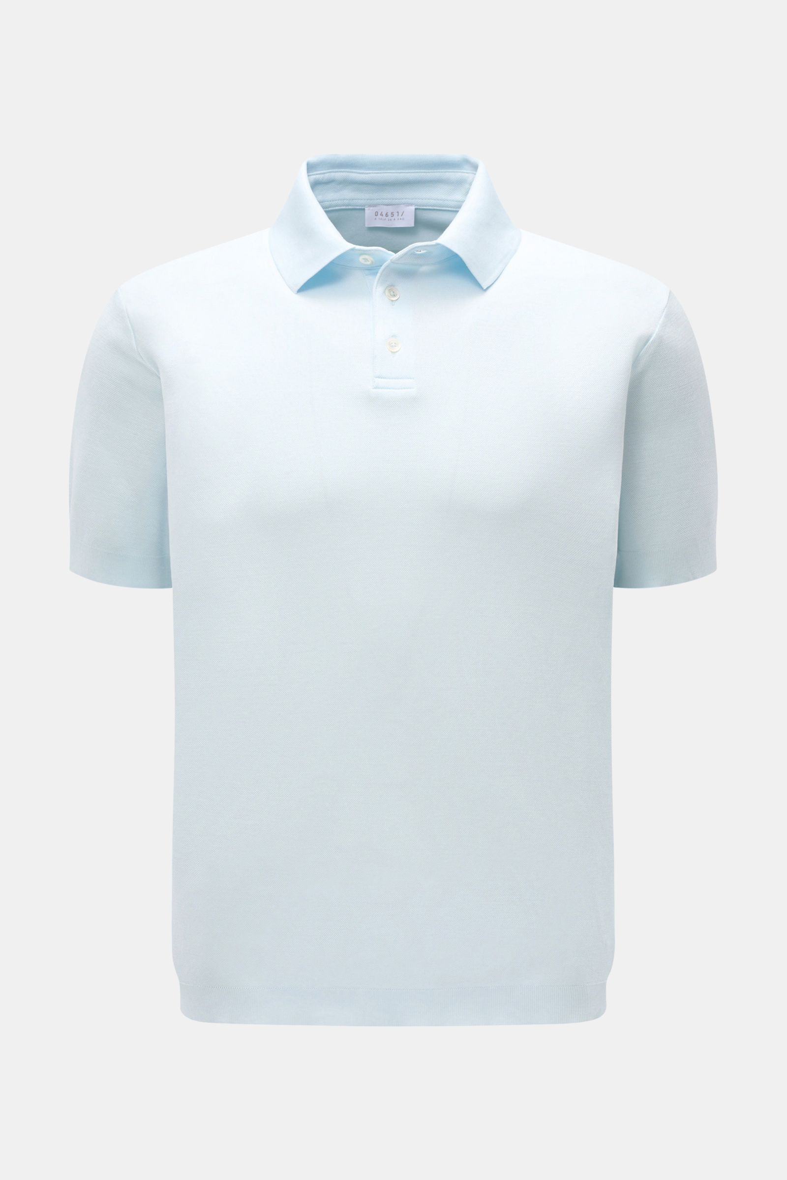 Front view of 04651/ A trip in a bag Poloshirt 'TP' pastellblau, a pastel blue pure cotton piqué polo shirt with a soft feel, regular fit, classic collar, smooth button placket, small side seam label, and comfortable ribbed cuffs. Ob im Urlaub oder Off