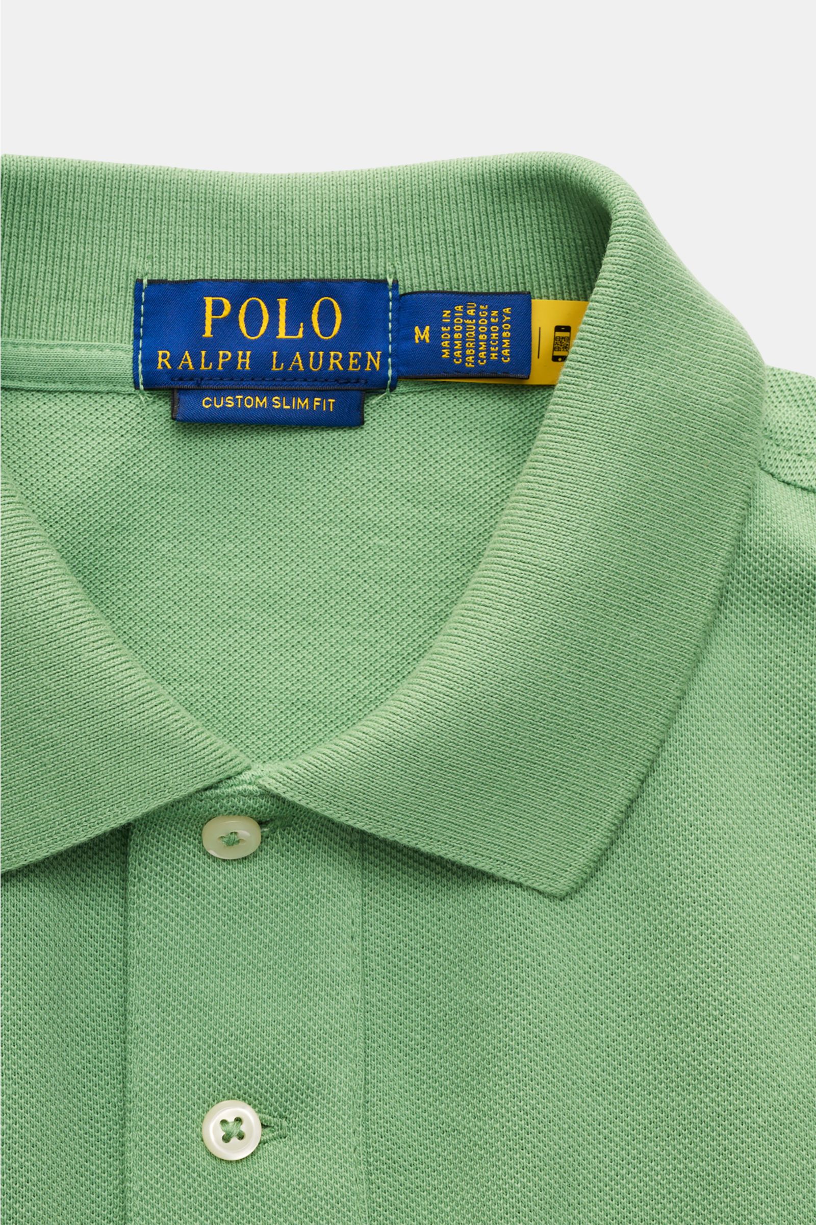 Polo Ralph Lauren Poloshirt mintgrün aus Baumwoll-Piqué, Slim Fit, mit Polokragen, Zwei-Knopf-Leiste, elastischen Ärmelbündchen, seitlichen Saumschlitzen, fotografiert von oben.