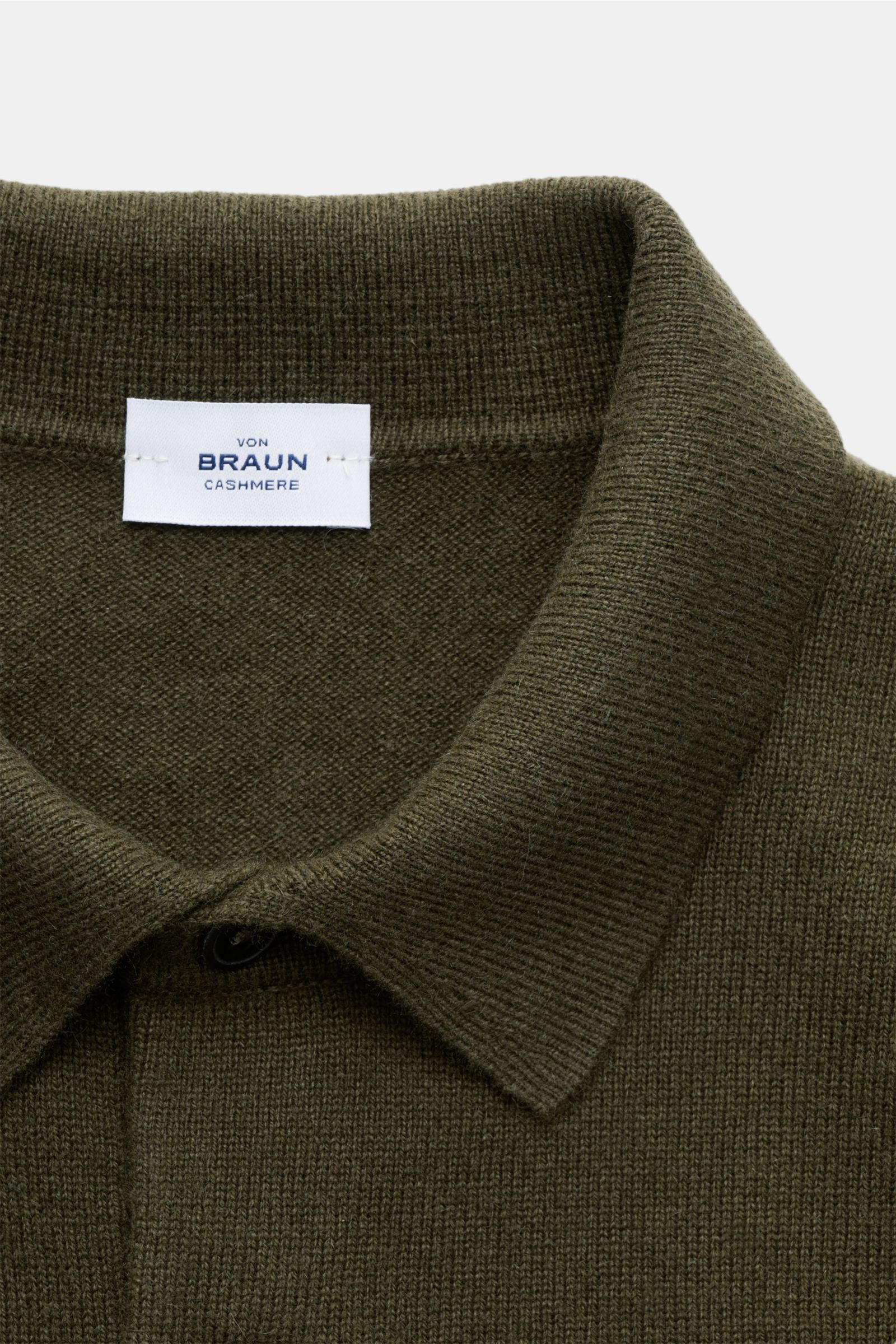 Close-up front view of the von Braun Cashmere knit polo dark olive showcasing the fine knit, signature collar, and three-button placket, made from pure Mongolian cashmere for exceptional softness and warmth. Elegant basic for the cold season: This VON BRA