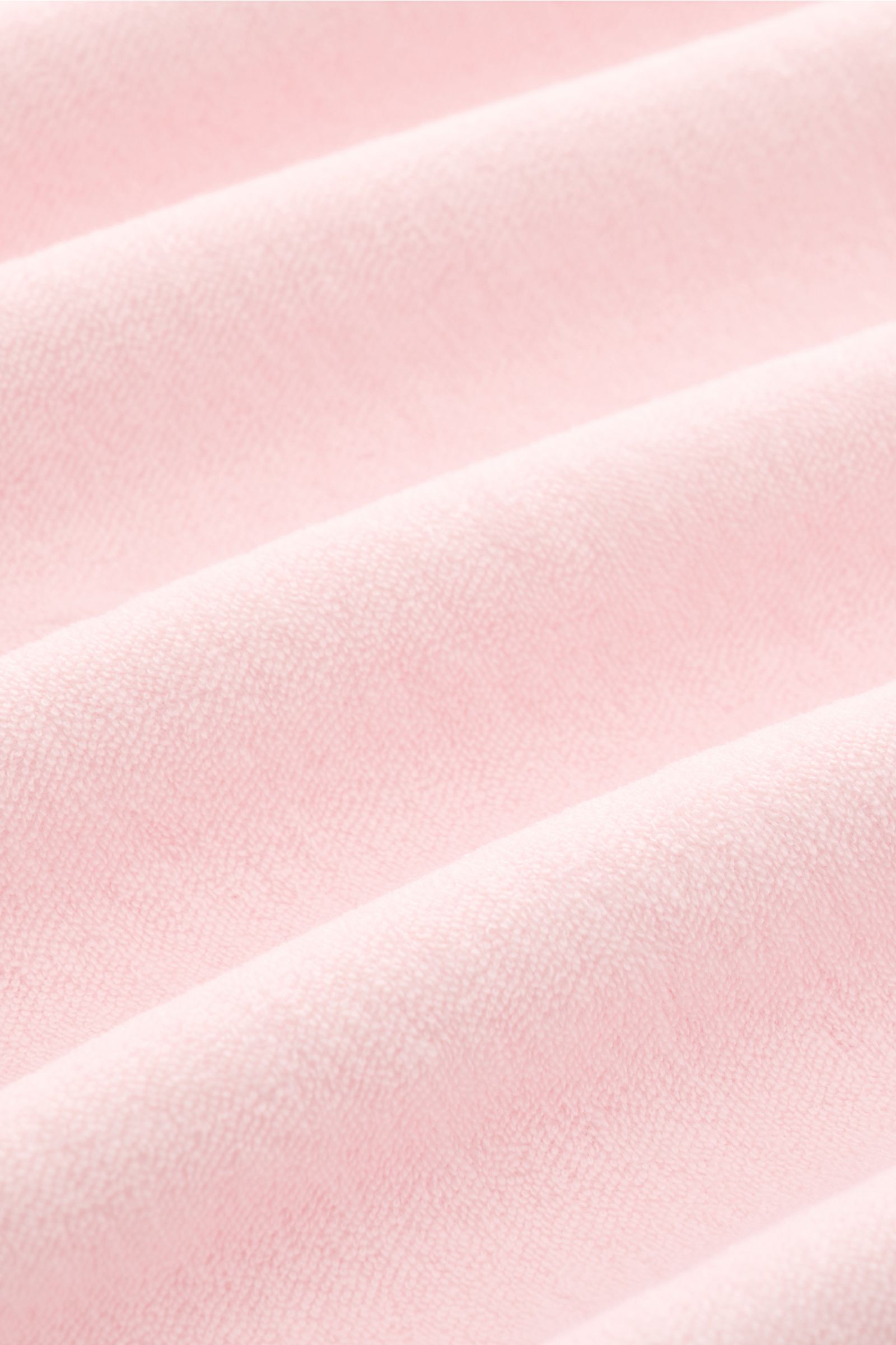 Nahaufnahme des 04651/ A trip in a bag Frottee Longsleeve-Poloshirt 'Terry Johnny' rosé aus weichem Baumwoll-Frottee mit feiner Struktur.