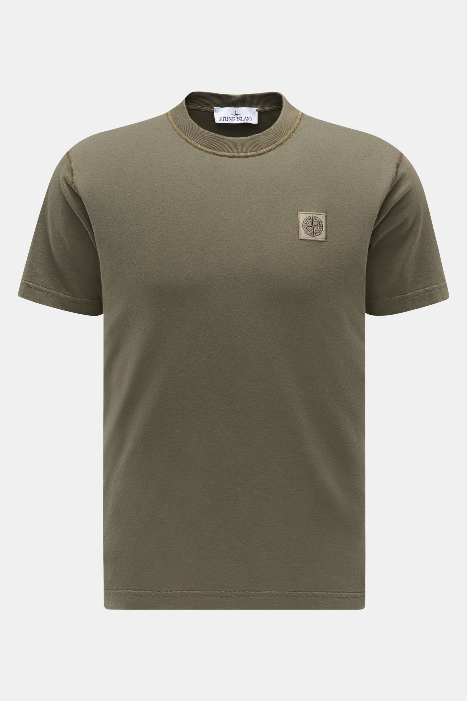Front view of Stone Island Crew neck T-shirt olive in slim fit, made of organic cotton with soft feel and distinctive overlock seams.

STONE ISLAND delivers an essential basic for your casual wardrobe with this relaxed T-shirt made of organic cotton fe