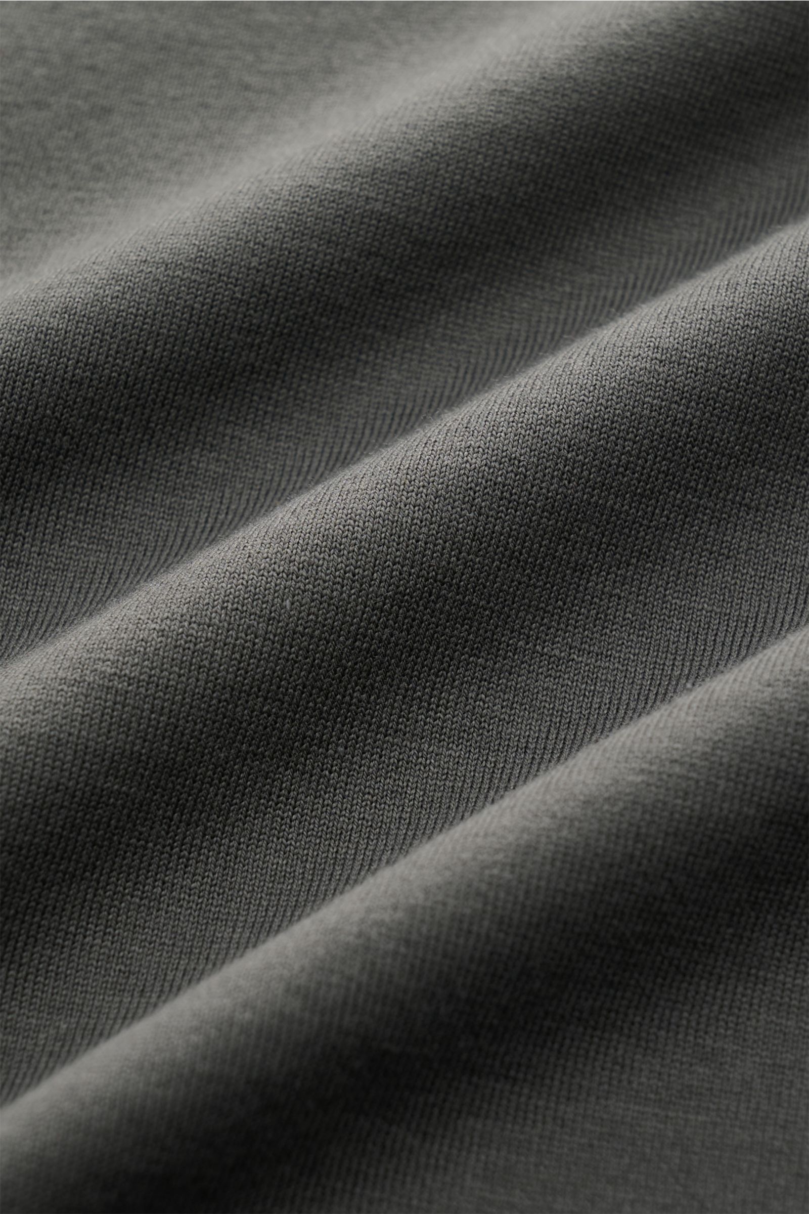 Close-up front view of dark grey fabric texture showing fine knit of Stefan Brandt Crew neck T-shirt 'Eli' made from pure Pima cotton, very soft touch, slim fit, crew neck.