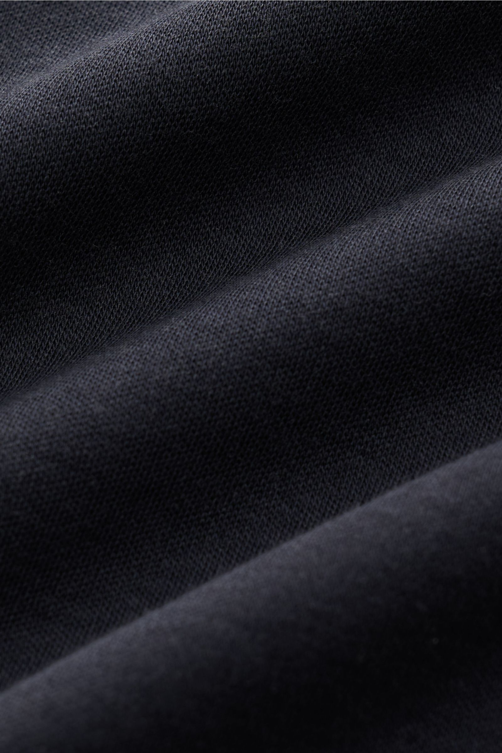 Close-up fabric texture of Stefan Brandt Crew neck T-shirt 'Sea Island Eli' dark navy, showing premium Sea Island cotton knit, soft feel.

Description: Jersey in premium quality: The label STEFAN BRANDT has put its expert knowledge of materials into the T