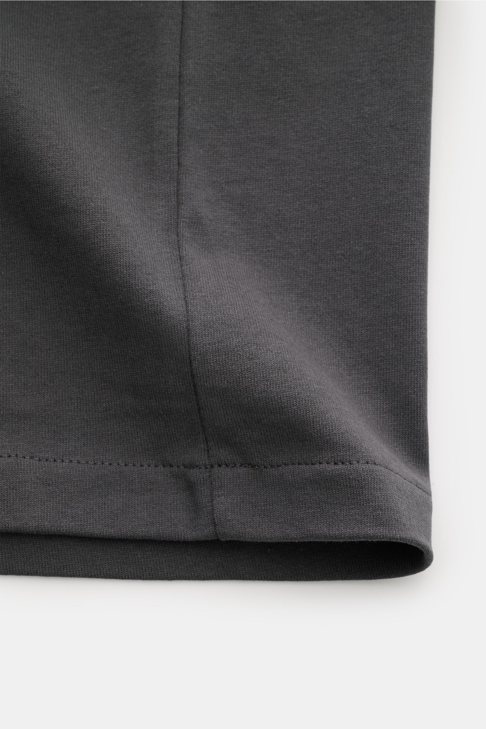 Close-up of the hem and side seam of the A.P.C. Crew neck T-shirt 'Standard Rue Madame' dark grey, showing soft cotton jersey fabric texture from a front-side perspective.

Clean, cool, A.P.C. – the T-shirt 'Standard Rue Madame' is the epitome of Frenc