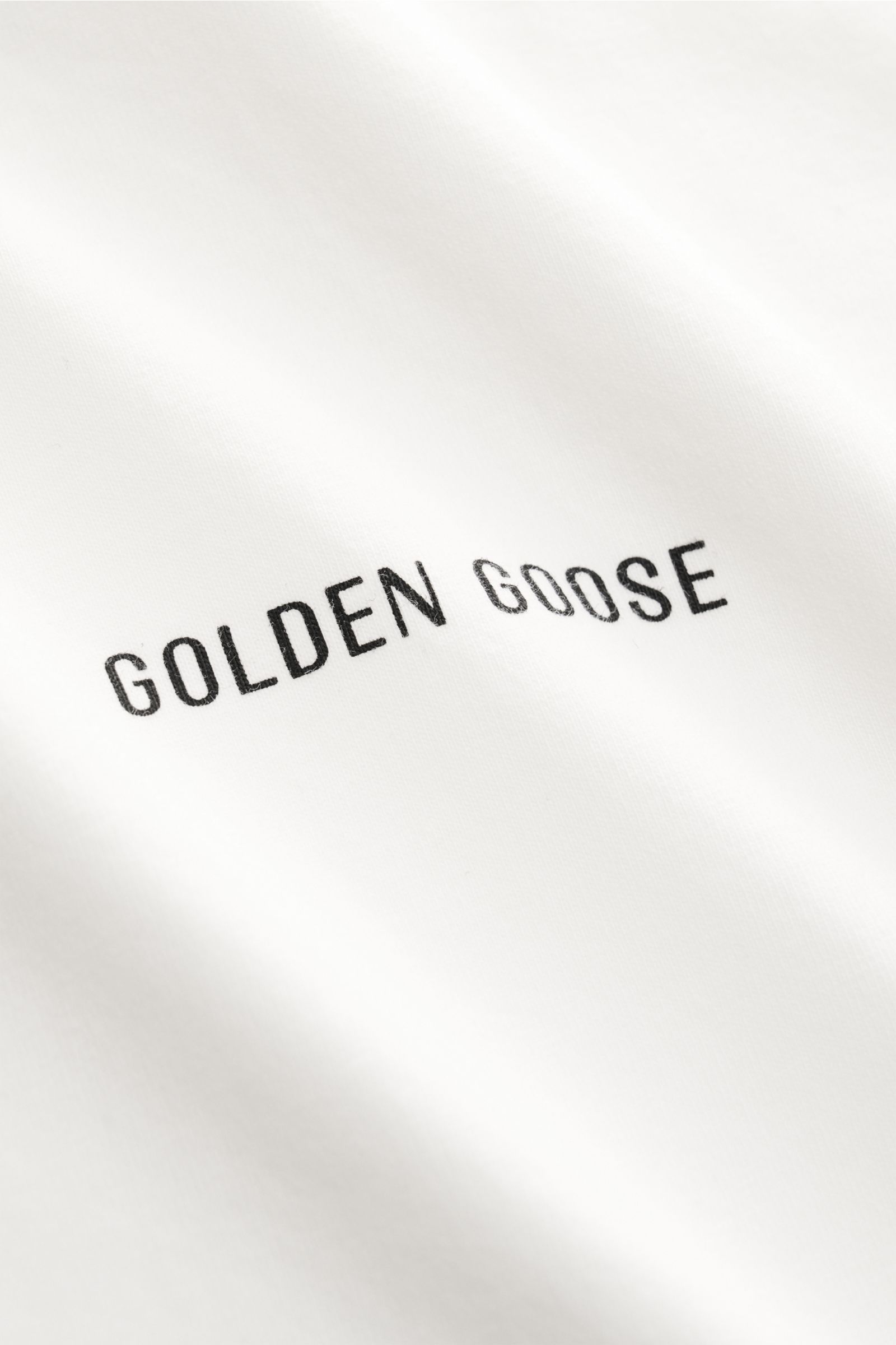 Golden Goose Rundhals-T-Shirt offwhite in Nahaufnahme, weicher Baumwoll-Jersey mit dezentem Logo-Print und lässigem Charakter.