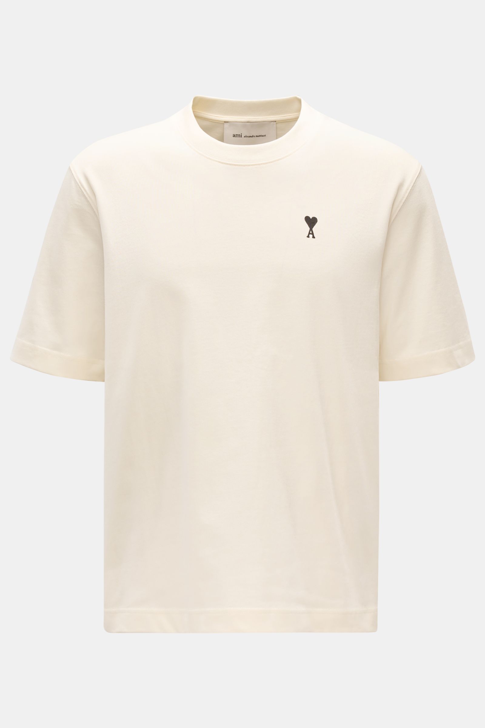 Ami Paris Rundhals-T-Shirt creme shown from the front, made of soft organic cotton jersey with a tonal stitched heart logo on chest. 

Monochromes Jersey-Basic vom französischen Label AMI PARIS: Dieses T-Shirt mit Rundhalsausschnitt ist aus reiner Bio-