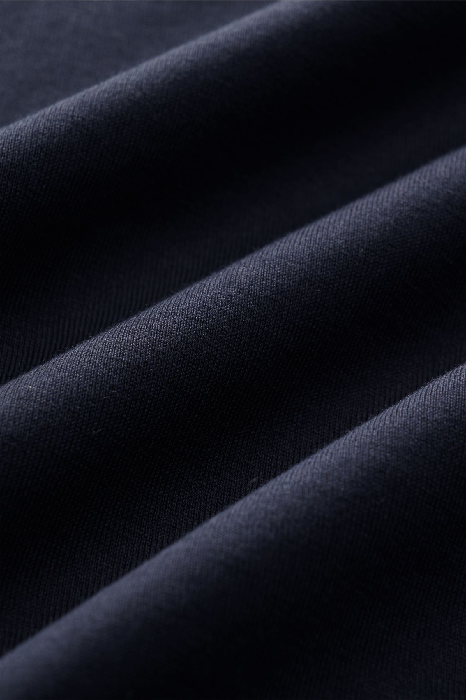 Close-up front view of navy fabric showing texture and folds of the Stefan Brandt Rundhals-T-Shirt 'Eli' navy, jersey in finest quality made of pure 'Urpima Sea Island' cotton with very soft touch, slim fit, and round neckline.