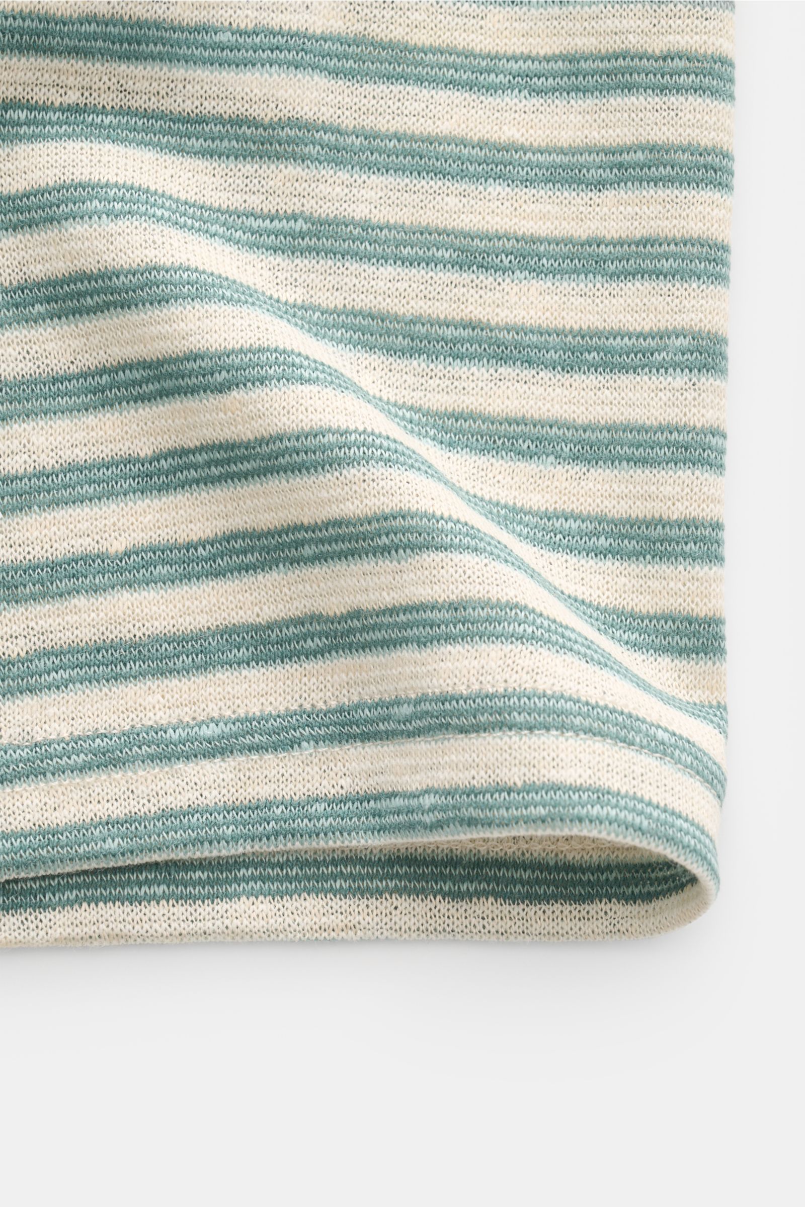 Close-up of the fabric edge of the MC2 Saint Barth Crew neck T-shirt 'Dover Stripes' cream/turquoise striped, showing its soft linen blend texture from a side angle.

For your casual summer looks: The 'Dover Stripes' T-shirt by MC2 SAINT BARTH, made fr