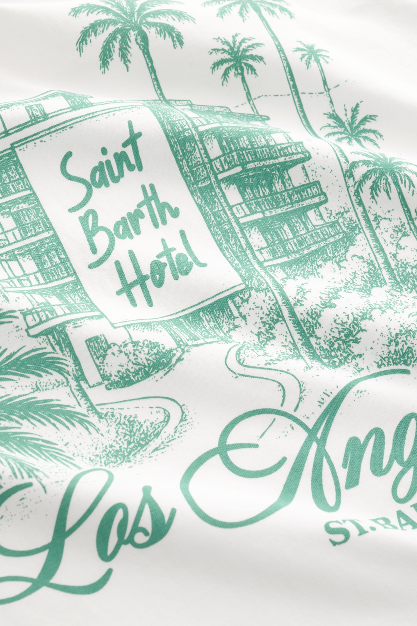 MC2 Saint Barth Crew neck T-shirt 'Portland' white showing a close-up of the green Los Angeles design print on soft organic cotton fabric. 

Urban eye-catcher: This T-shirt by MC2 SAINT BARTH, made from soft organic cotton, features a striking Los Ange