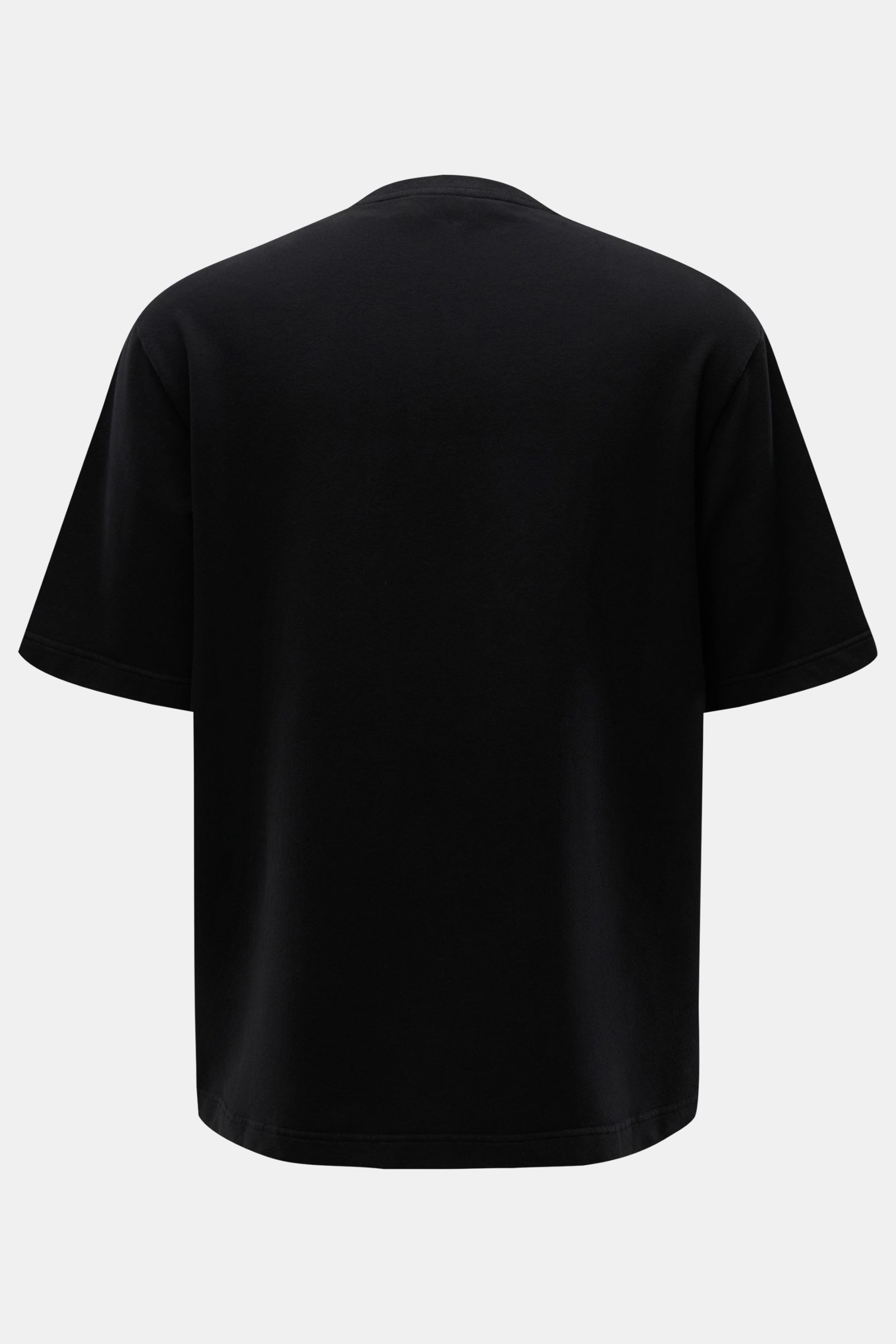 Black oversized 04651/ A trip in a bag Crew neck T-shirt 'If Tee' shown from the back, made of elasticated cotton jersey, very soft, heavy fabric, with woven label in side seam. The uncomplicated cotton T-shirt 'IF Tee' by 04651/ A TRIP IN A BAG is a core