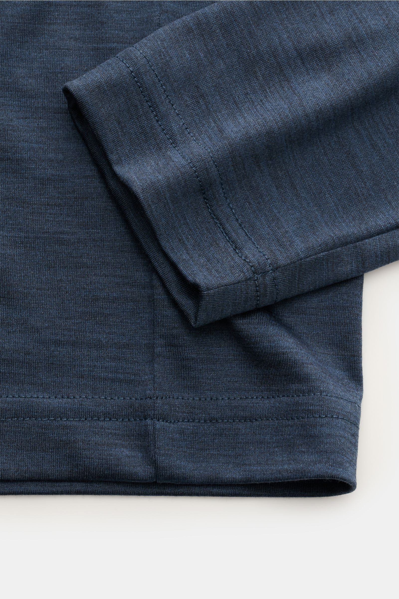 Close-up front view of Stefan Brandt Merino crew neck long sleeve 'Enno' dark blue mottled showing fine jersey fabric, slim fit, and soft texture. With the long sleeve 'Enno' in super fine merino wool, STEFAN BRANDT presents a timeless essential for style