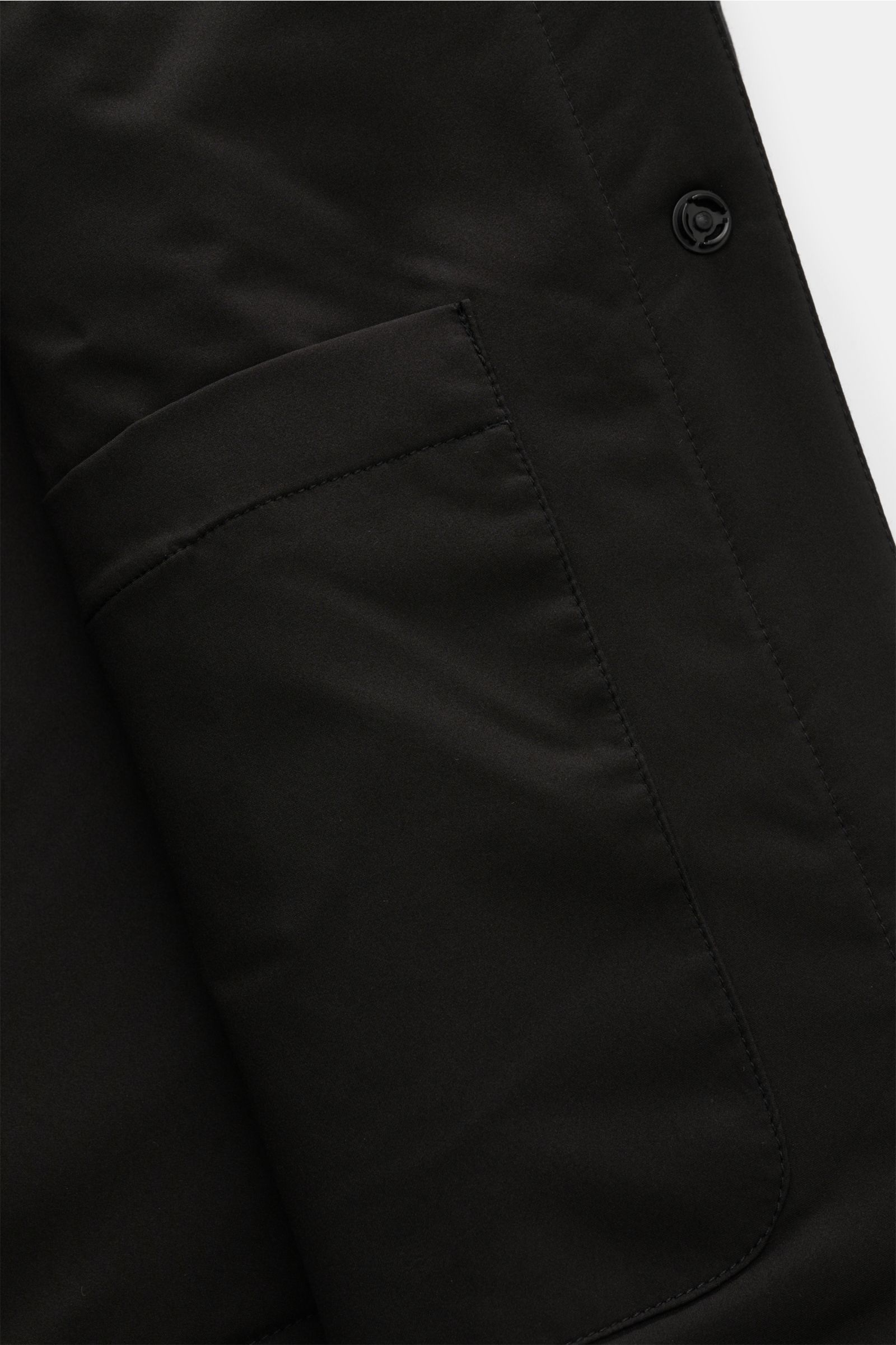 Close-up front-side view of the black 04651/ A trip in a bag Reversible overshirt black showing snap button placket, patch breast pockets with flap, and soft smooth blend of wool, cashmere, and premium-quality microfibre with lightweight padding, slight s