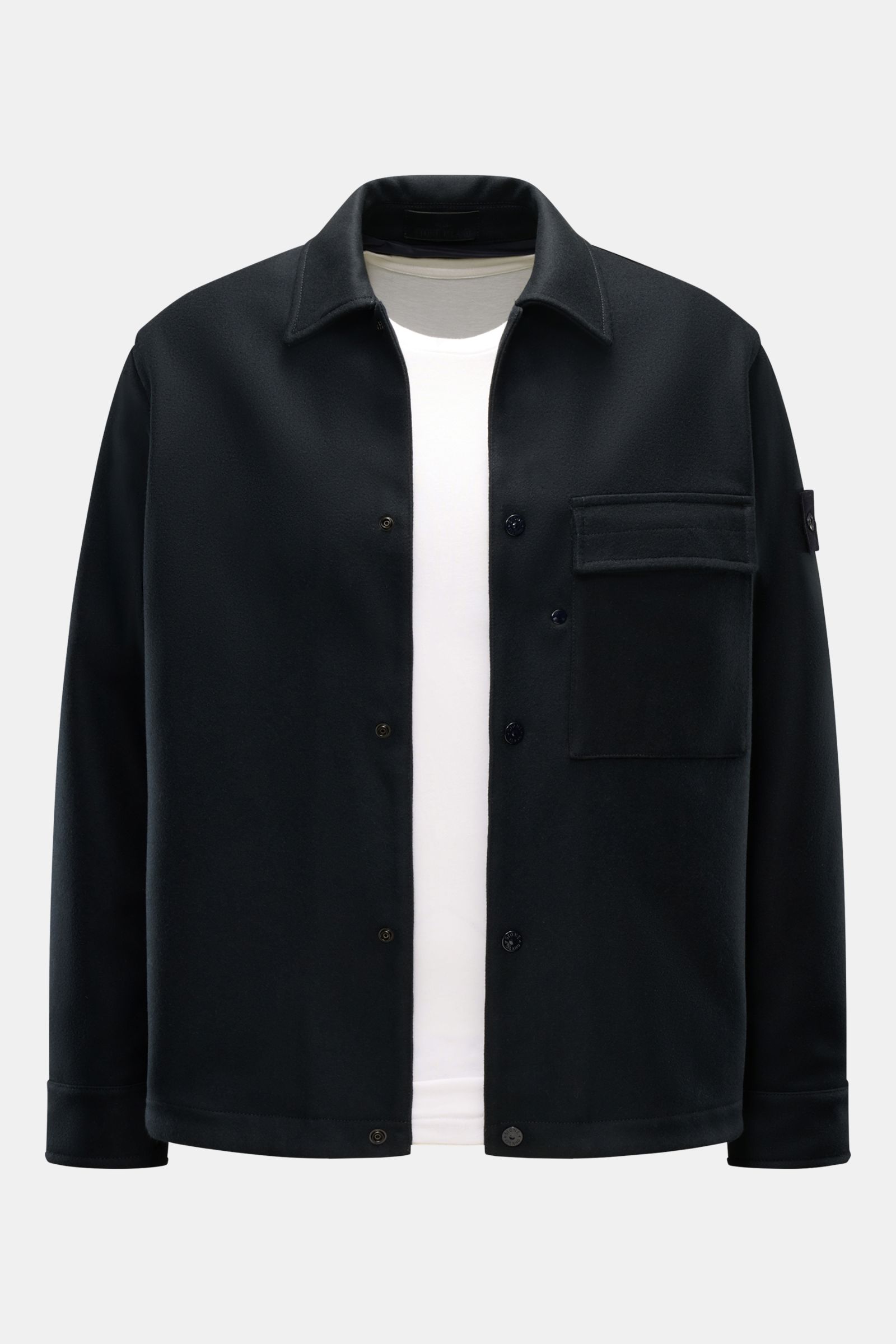 Front view of Stone Island Flannel overshirt 'Ghost Piece' dark navy in wool and microfibre with slim fit, snap buttons, turn-down collar, patch breast pocket, tonal compass badge, and soft feel.

Description: Pared down to the essentials but unmistaka