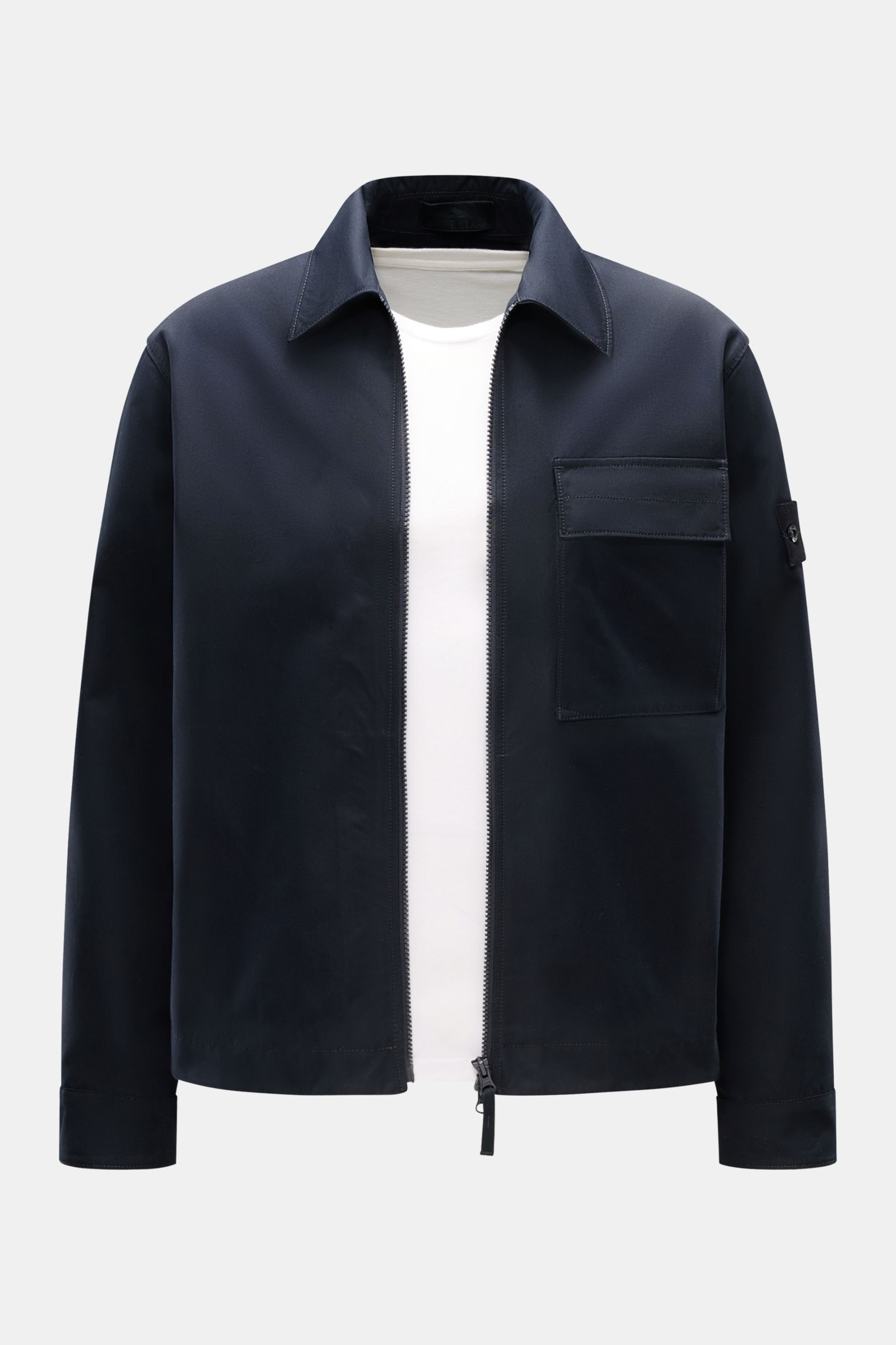 Front view of Stone Island Overshirt 'Weather Proof Cotton Canvas Ghost Piece' navy, featuring a slim fit, two-way zip, patch breast pocket, snap button cuffs, tonal compass badge, and wind and water-repellent cotton canvas material. 

Description: Get th