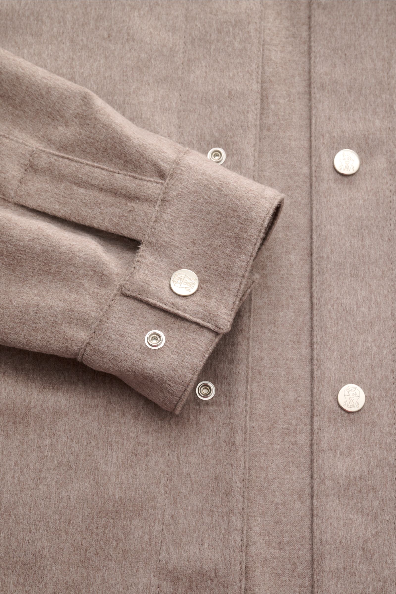 Close-up front view of the Brunello Cucinelli Cashmere overshirt sand mottled, showing soft pure cashmere fabric, six-button placket, slim fit, turn-down collar, jetted front pockets, buttoned cuffs, half lined with two inside pockets. Timeless classic fo