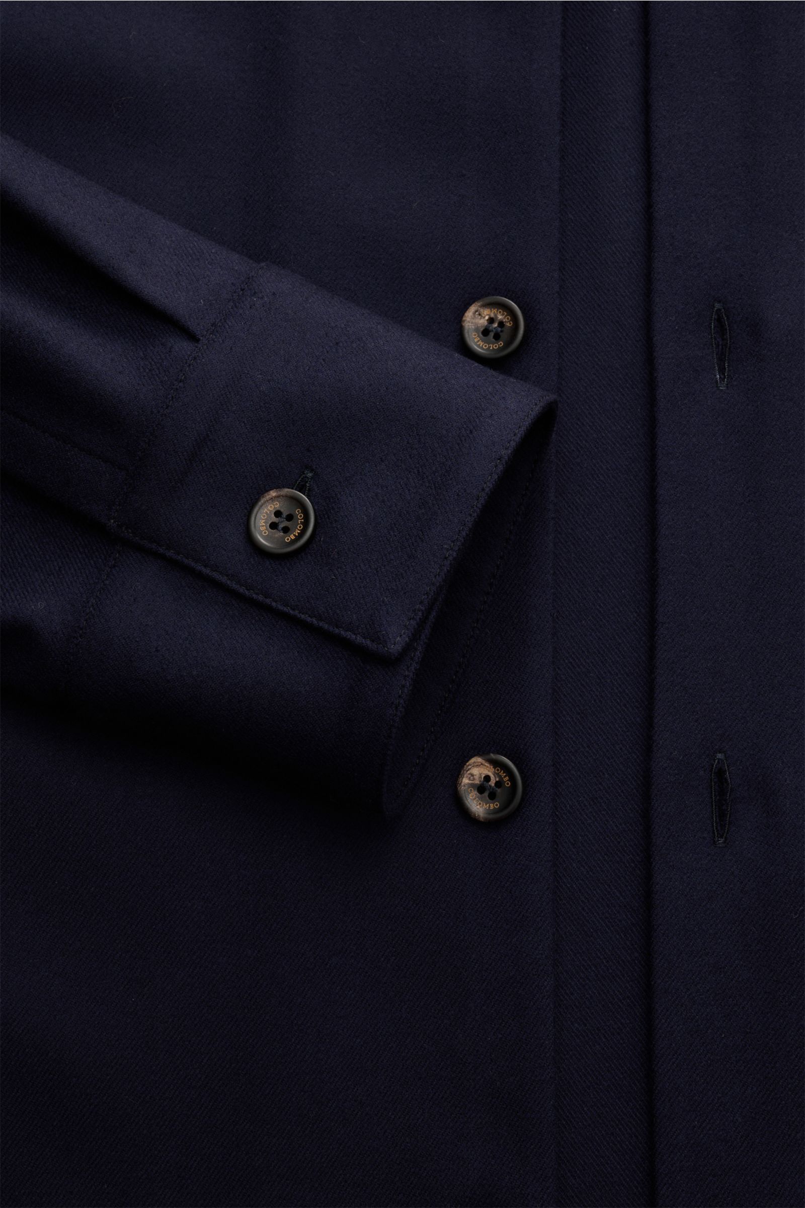 Close-up front-side view of the Colombo Overshirt navy showing six-button placket, turn-down collar, classic barrel cuffs, finest wool with microfibre, slightly elasticated fabric, very soft feel, slim fit, concealed side seam pockets, unlined, and two in