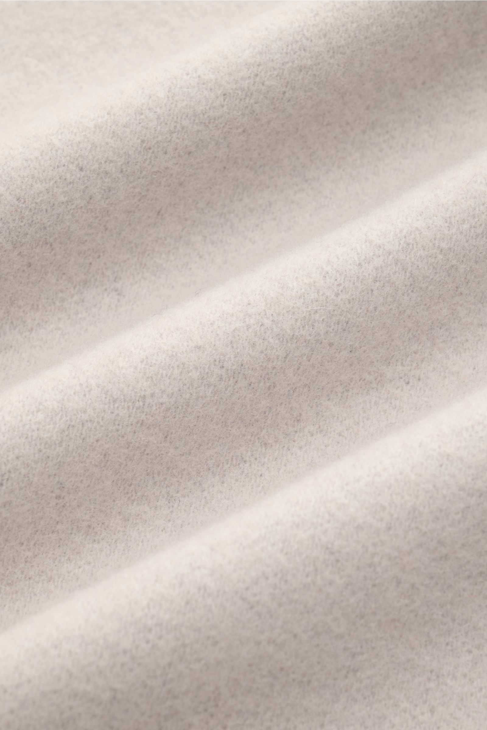 Close-up front view of the soft, light gray fabric of the Kiefermann Overshirt 'Elijaz' hellgrau, made of jersey wool and high-quality microfiber, with a soft touch, felted and brushed quality, slim fit, concealed snap button placket, turn-down collar, pa