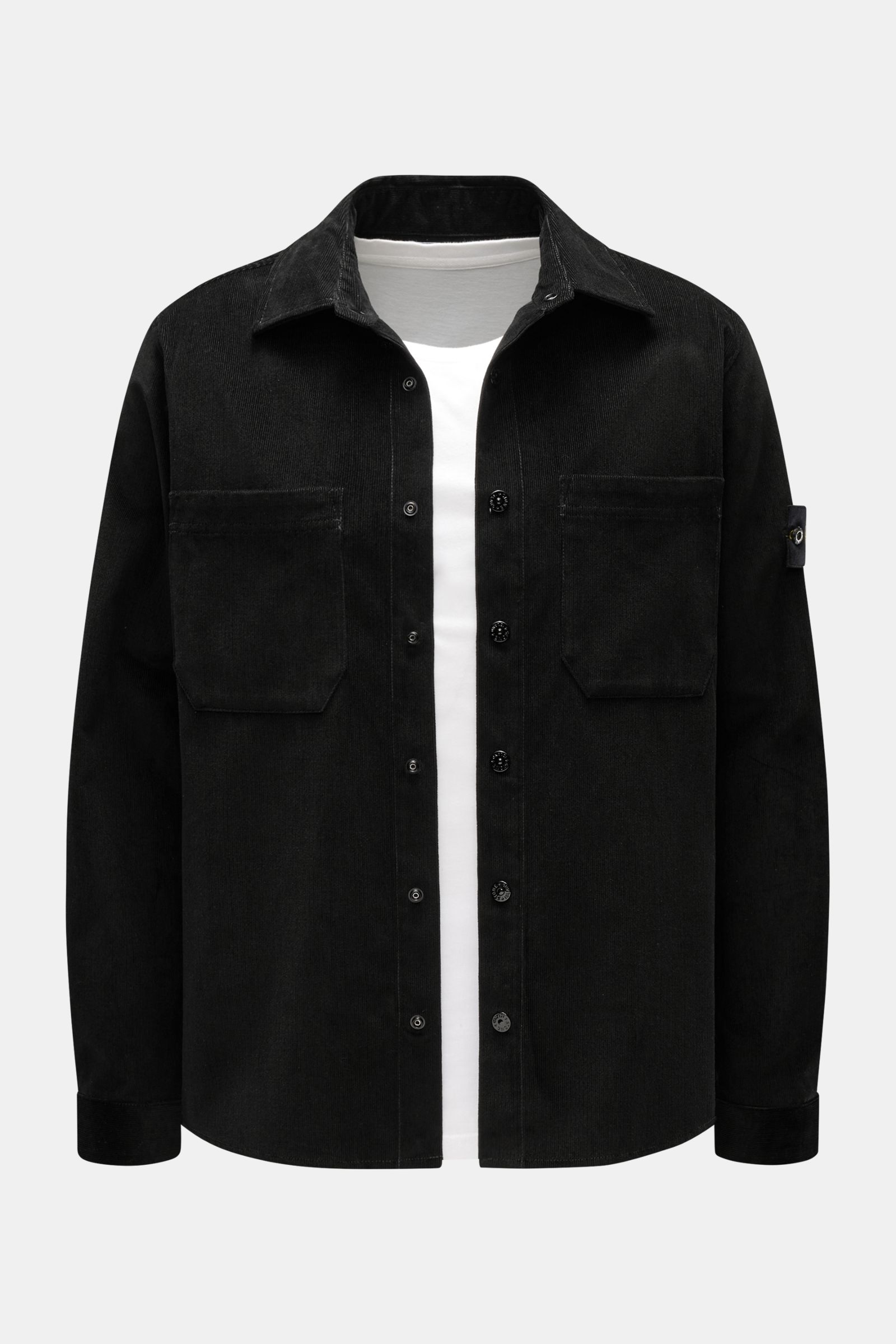Front view of Stone Island Corduroy overshirt black in pure cotton corduroy with snap buttons, patch pockets, and signature compass badge on sleeve.

Sporty and practical – this straight cut overshirt by STONE ISLAND is characterised by iconic style an