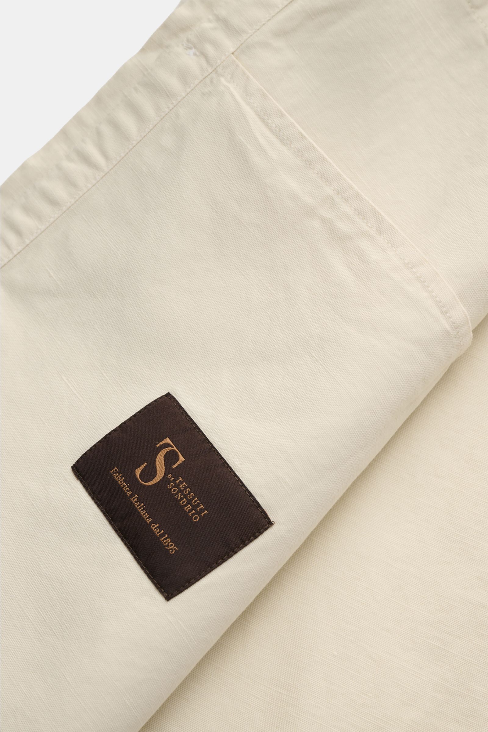 Belstaff Overshirt 'Maritime' sand close-up from above showing cotton-linen fabric texture and Tessuti di Sondrio label.