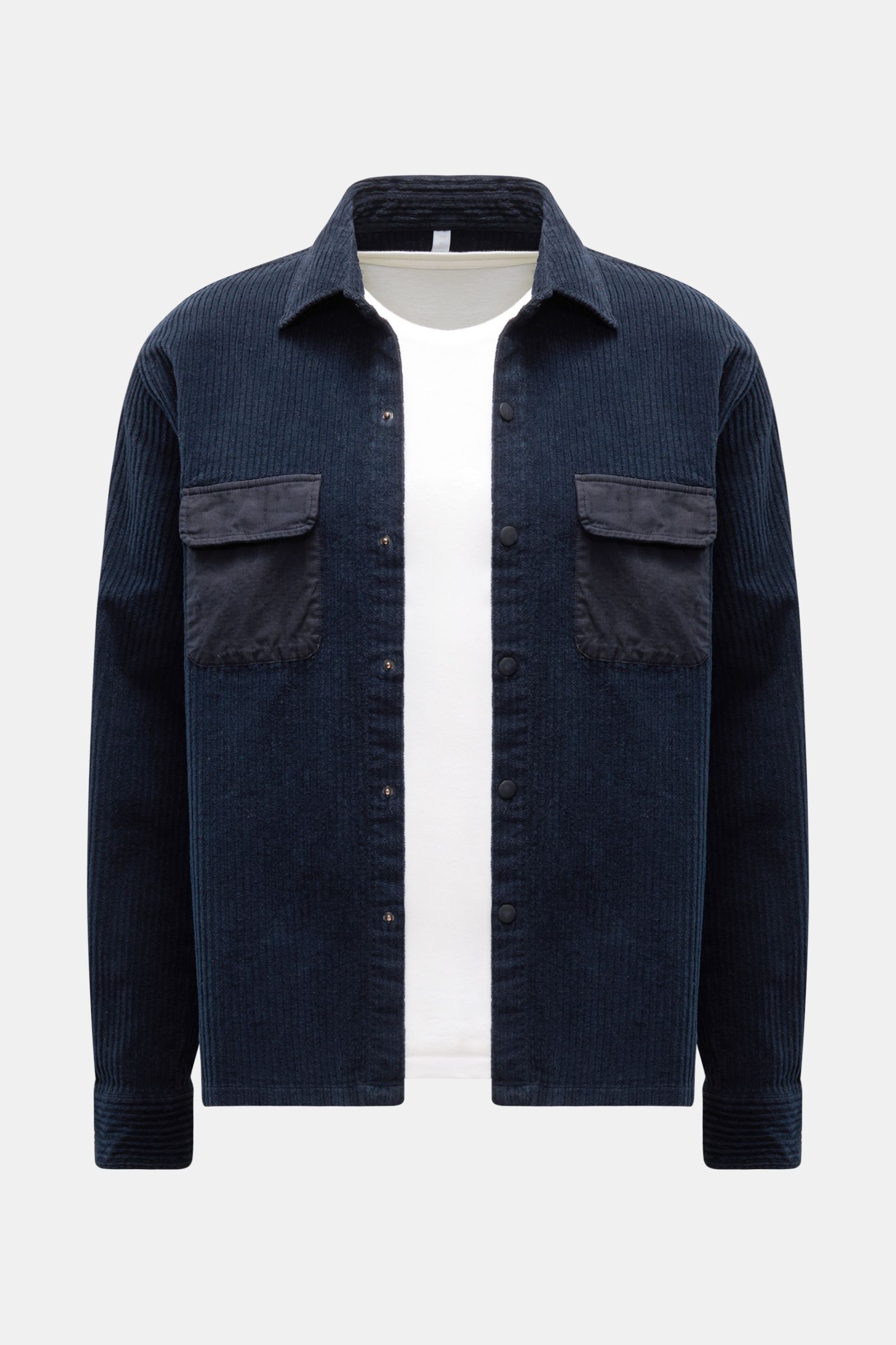 Front view of the 04651/ A trip in a bag Cord-Overshirt navy, oversized with Kent collar, Breitcord cotton, stretch, soft feel, garment dyed, snap button placket, contrast chest pockets, snap cuffs, and straight hem.